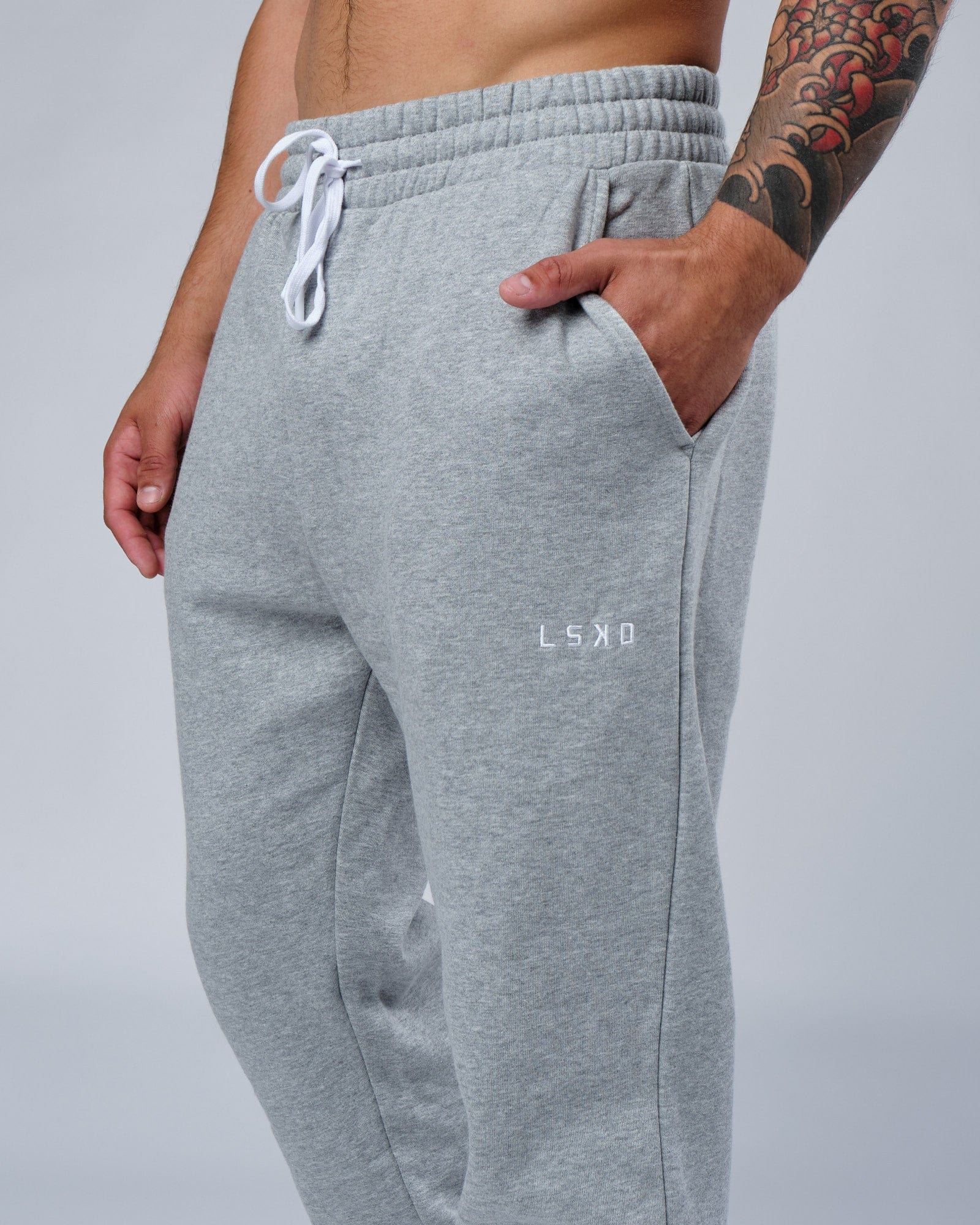Model wearing Ready Track Pant - Lt Grey Marl