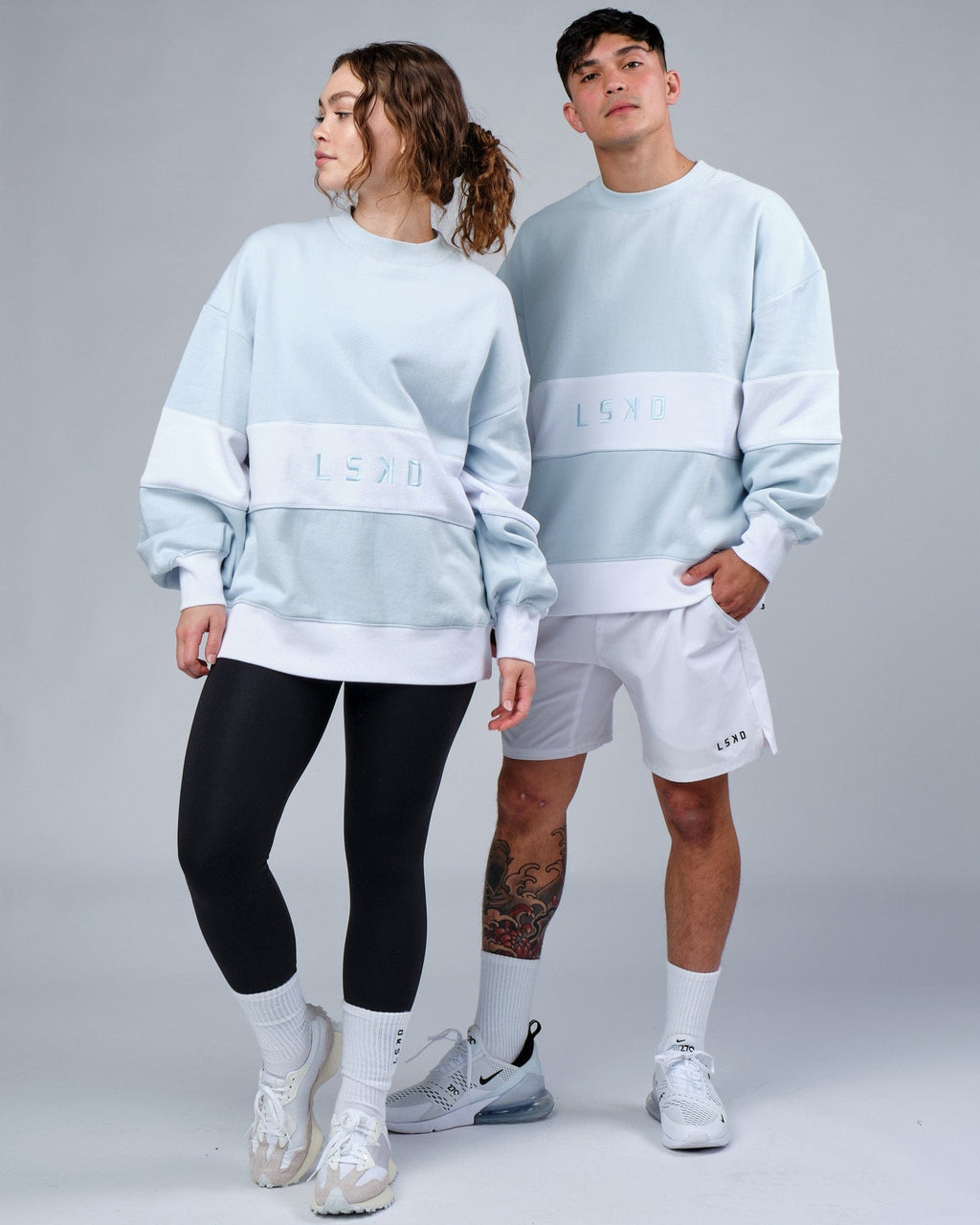Model wearing Unisex Extra Time Sweater Oversize - Ballad Blue