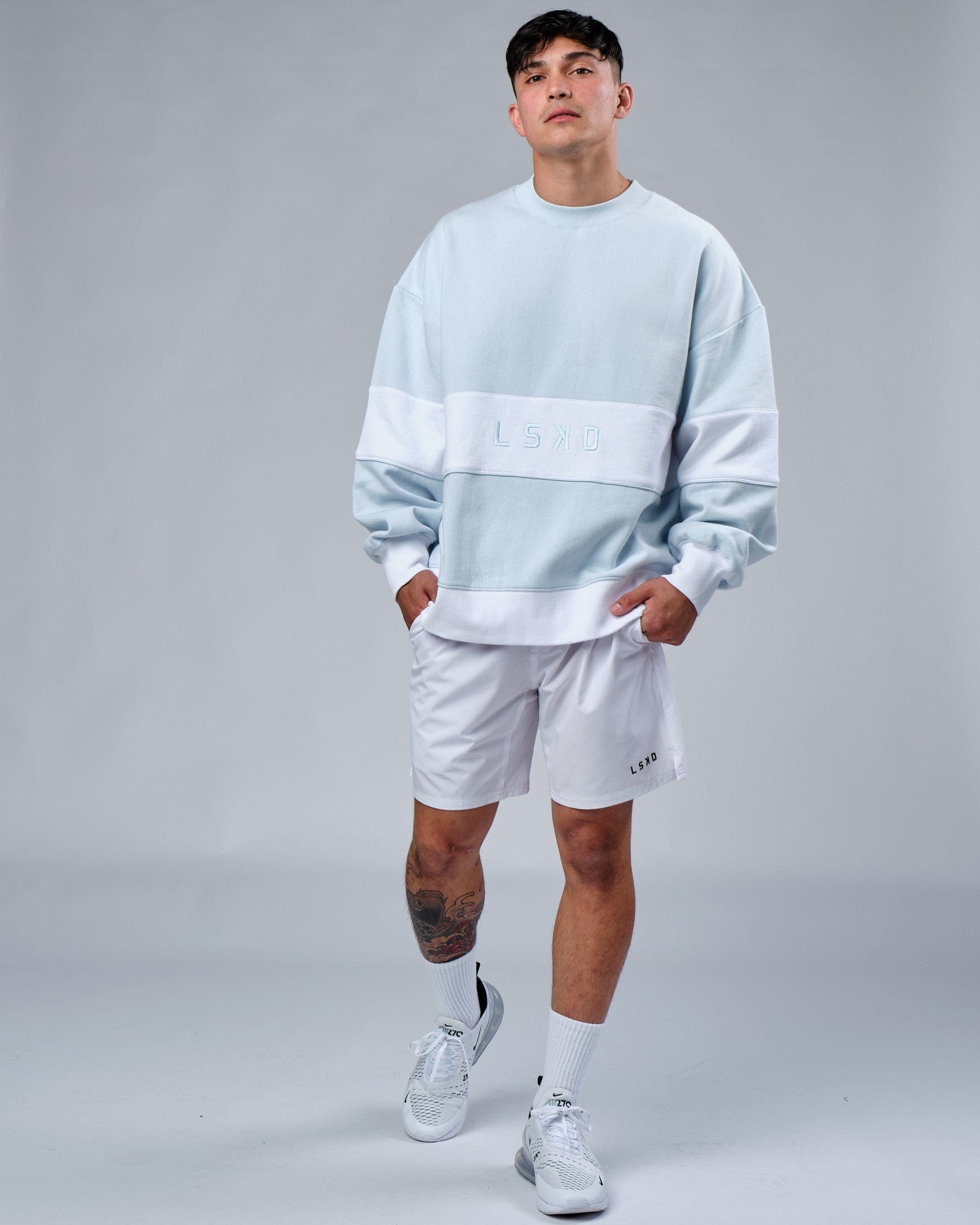 Model wearing Unisex Extra Time Sweater Oversize - Ballad Blue