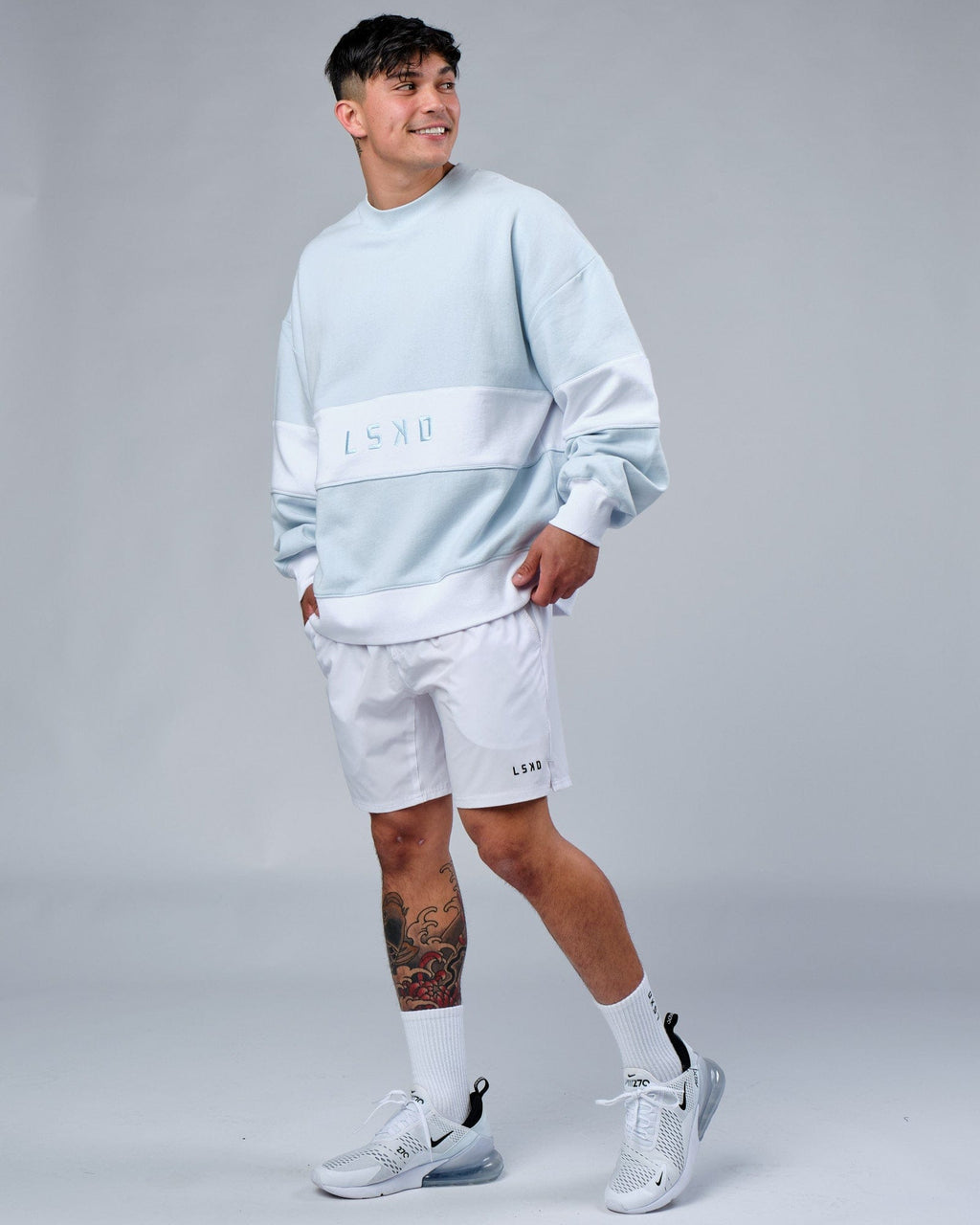 Model wearing Unisex Extra Time Sweater Oversize - Ballad Blue
