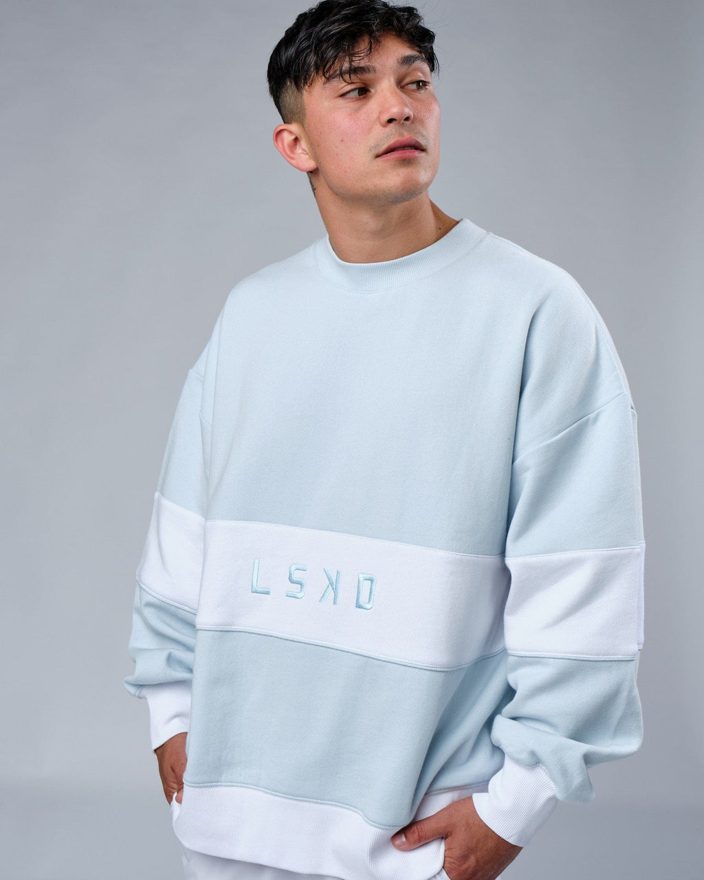 Model wearing Unisex Extra Time Sweater Oversize - Ballad Blue