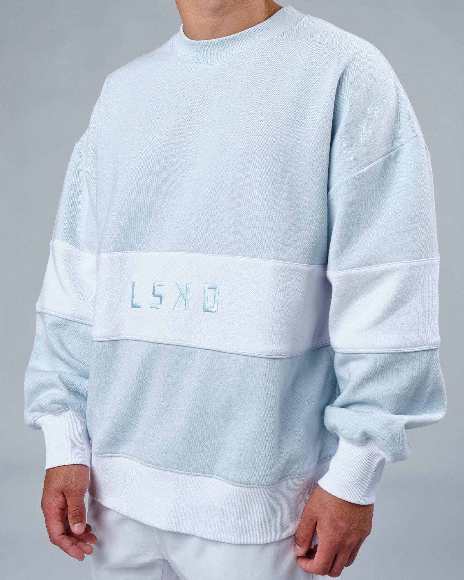 Model wearing Unisex Extra Time Sweater Oversize - Ballad Blue