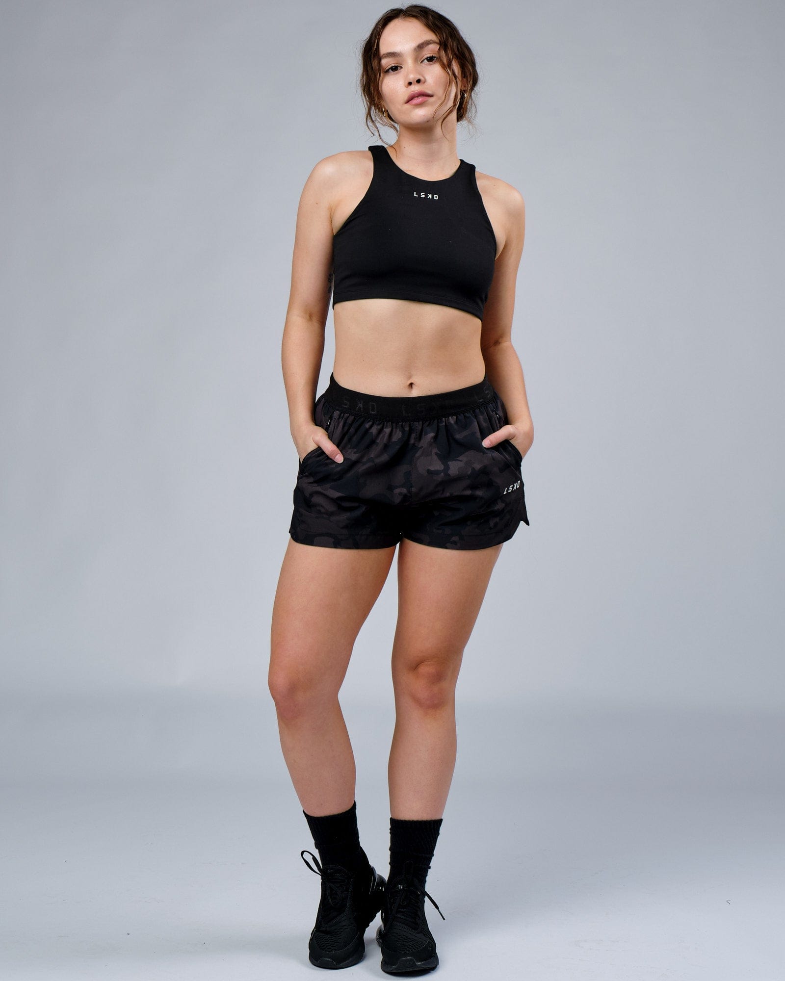 Model wearing Competition Performance Short - Black Camo