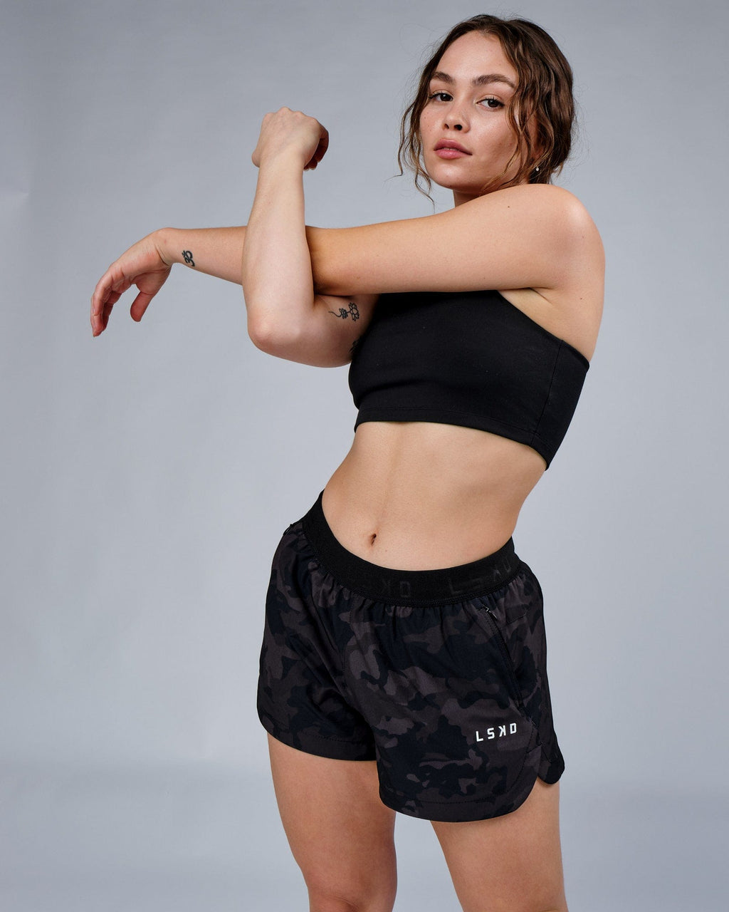Model wearing Competition Performance Short - Black Camo