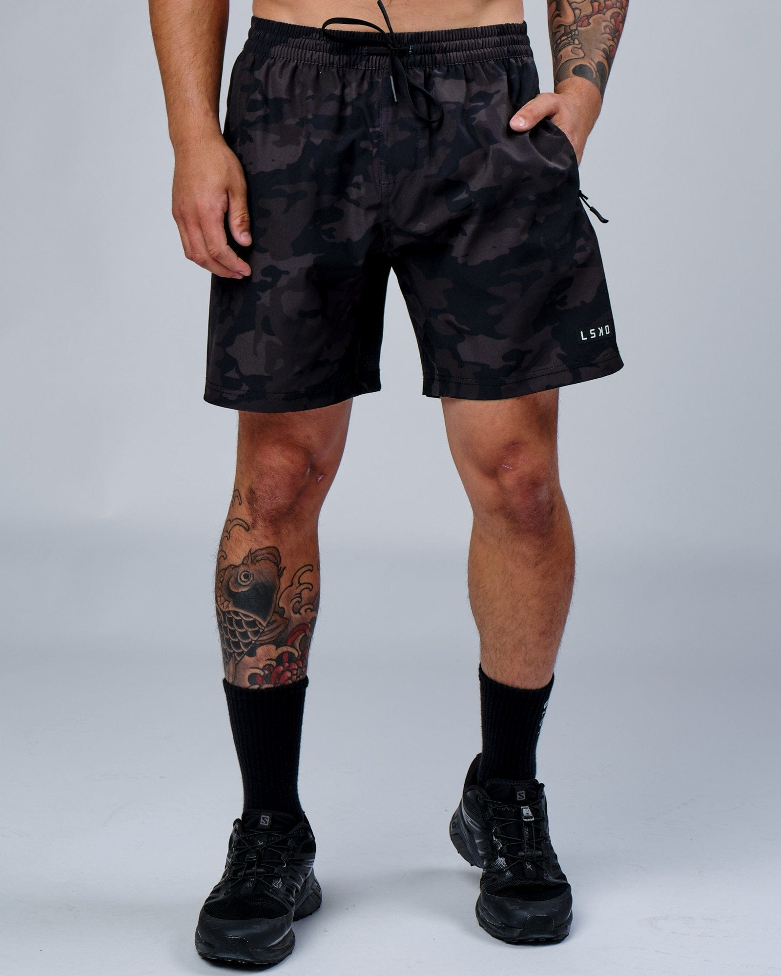 Model wearing Rep 7" Performance Short - Black Camo