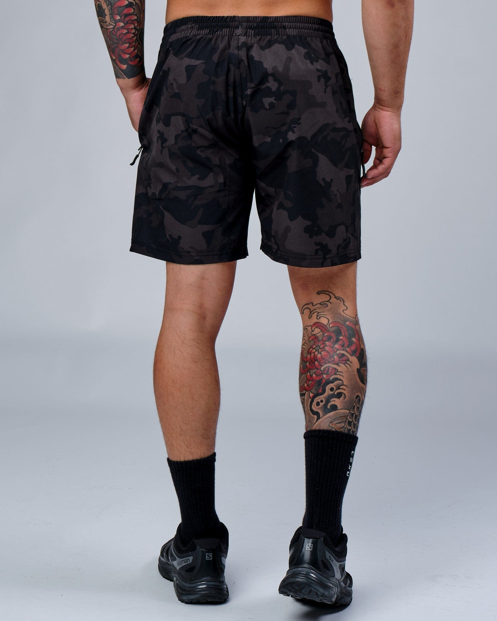 Model wearing Rep 7" Performance Short - Black Camo