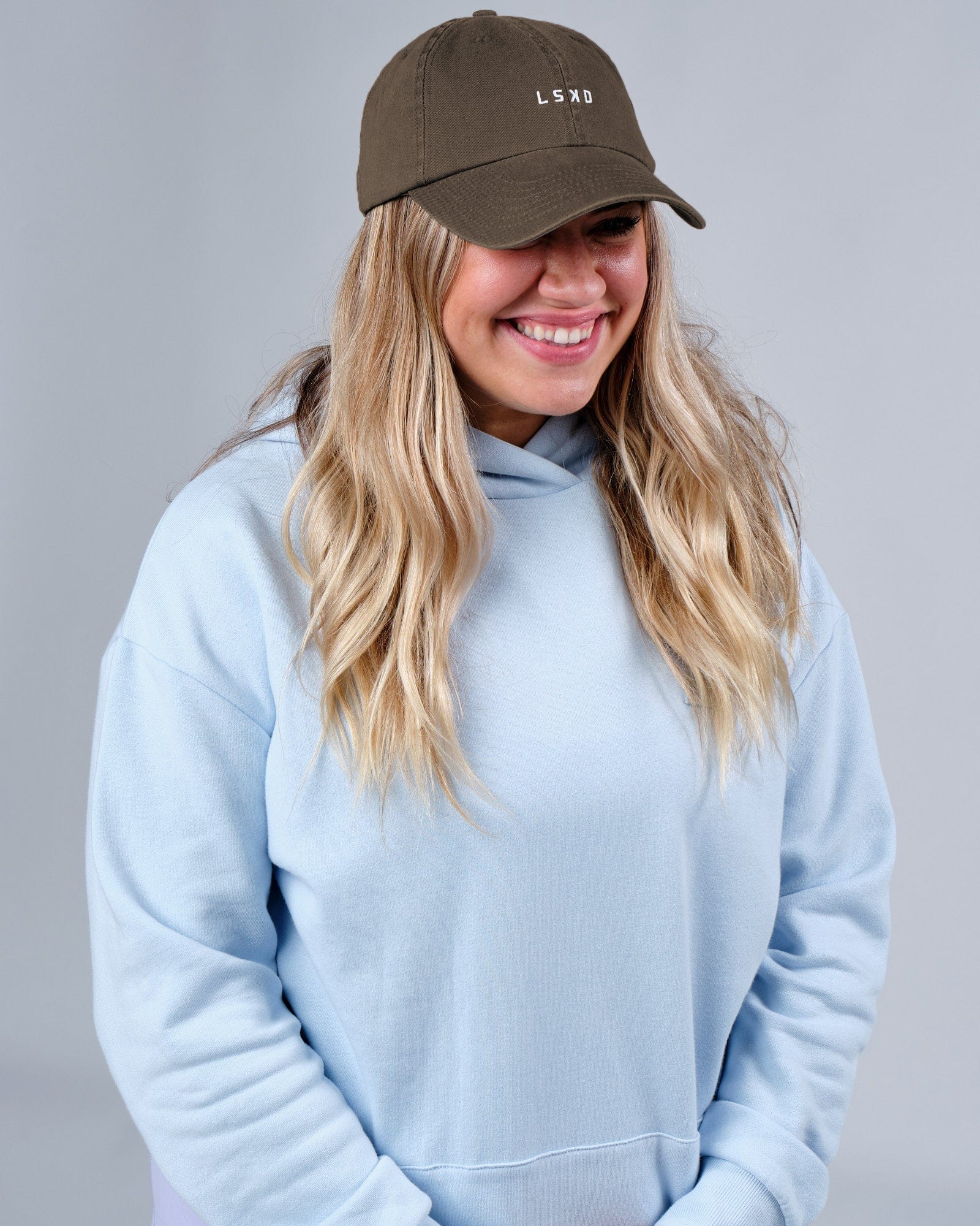 Model wearing Compact Hat - Fossil