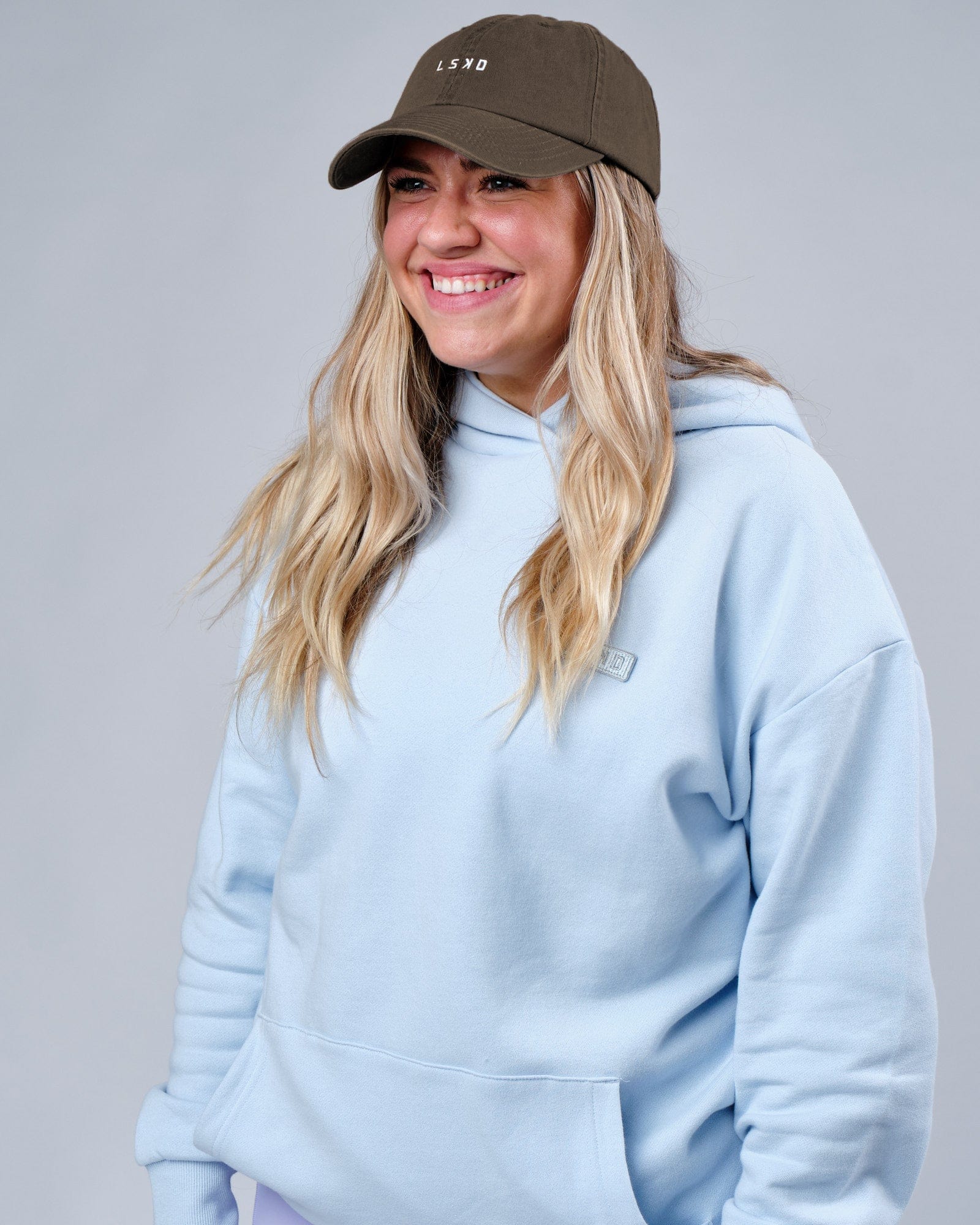 Model wearing Compact Hat - Fossil