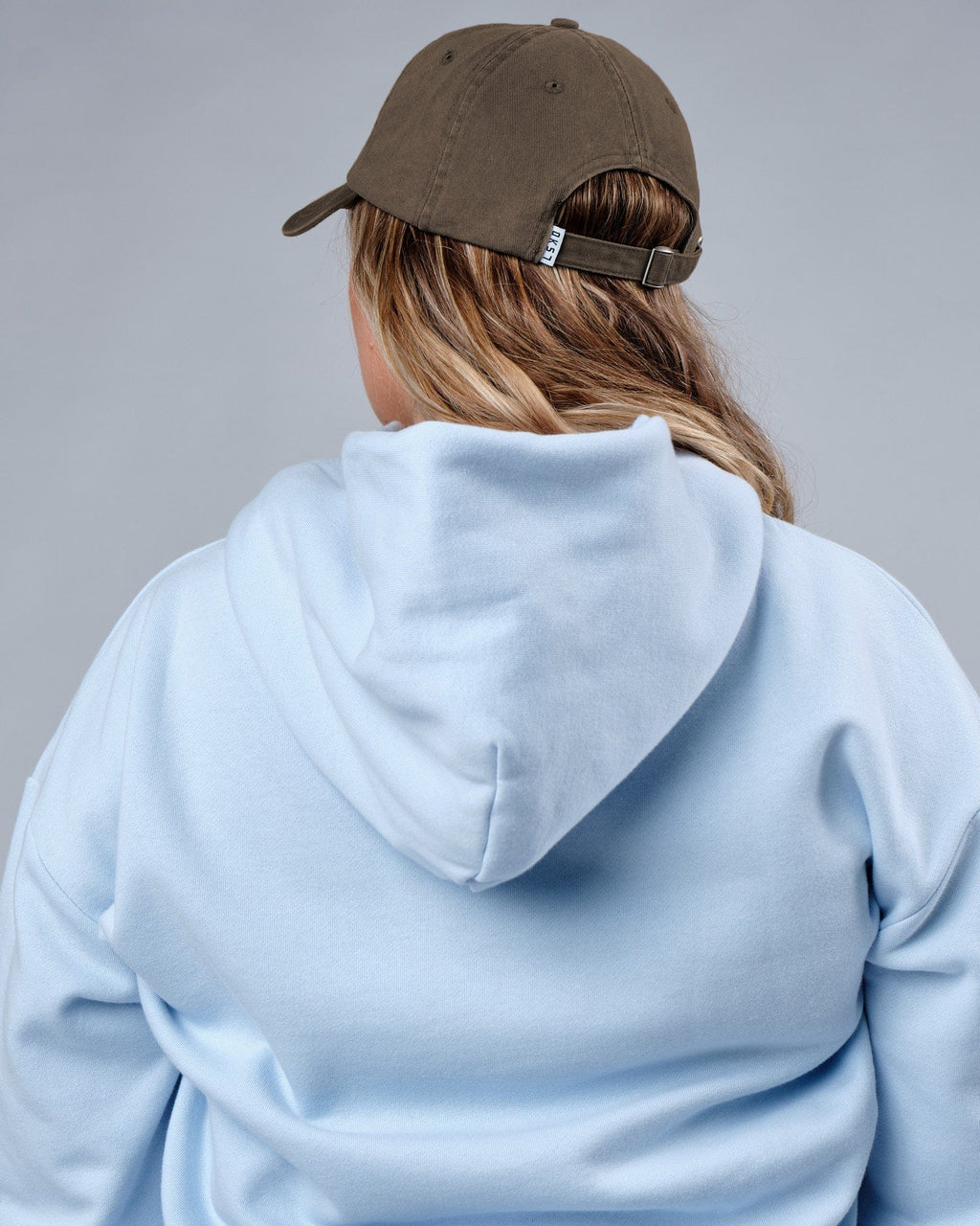 Model wearing Compact Hat - Fossil