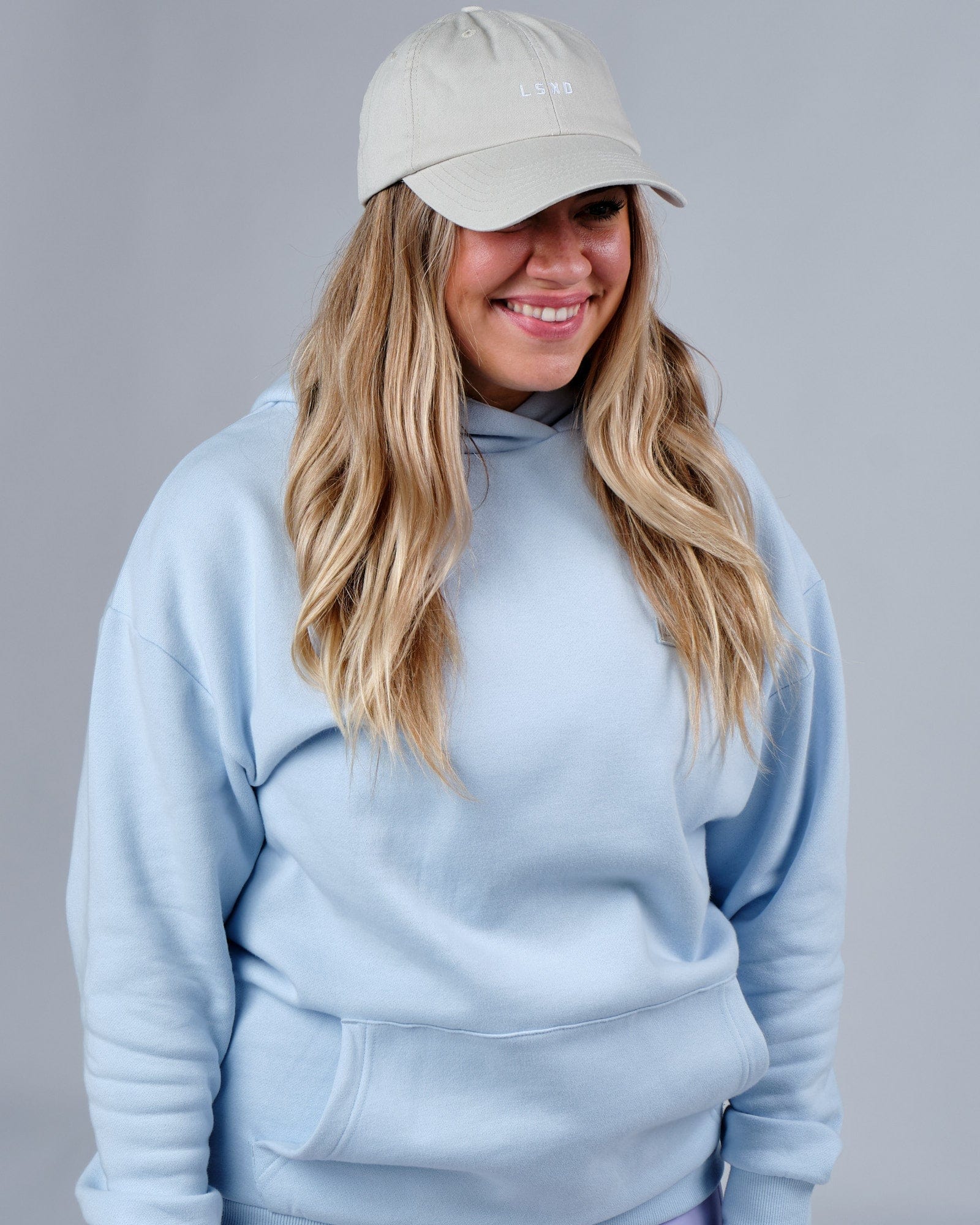 Model wearing Compact Cap - Bone