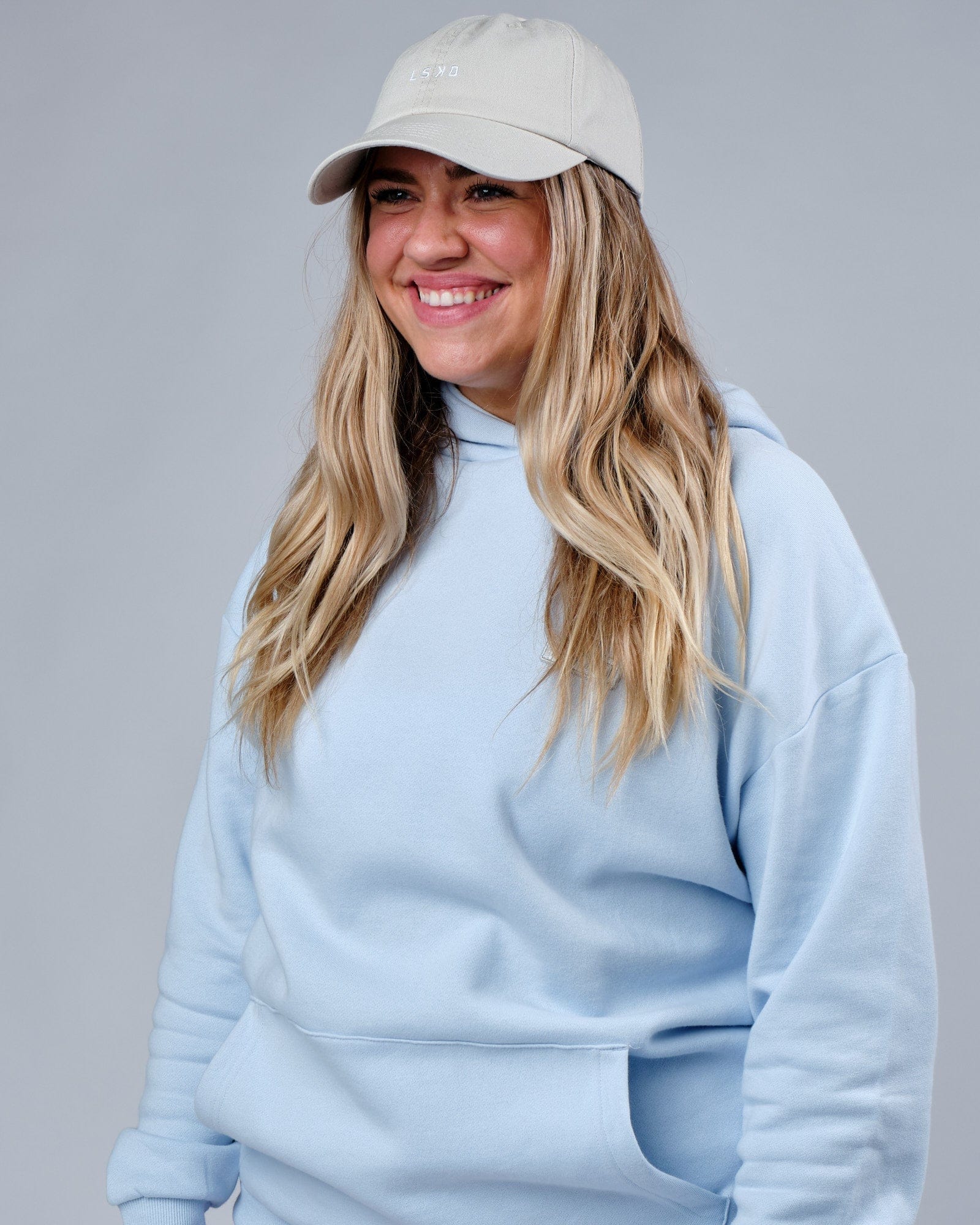 Model wearing Compact Cap - Bone