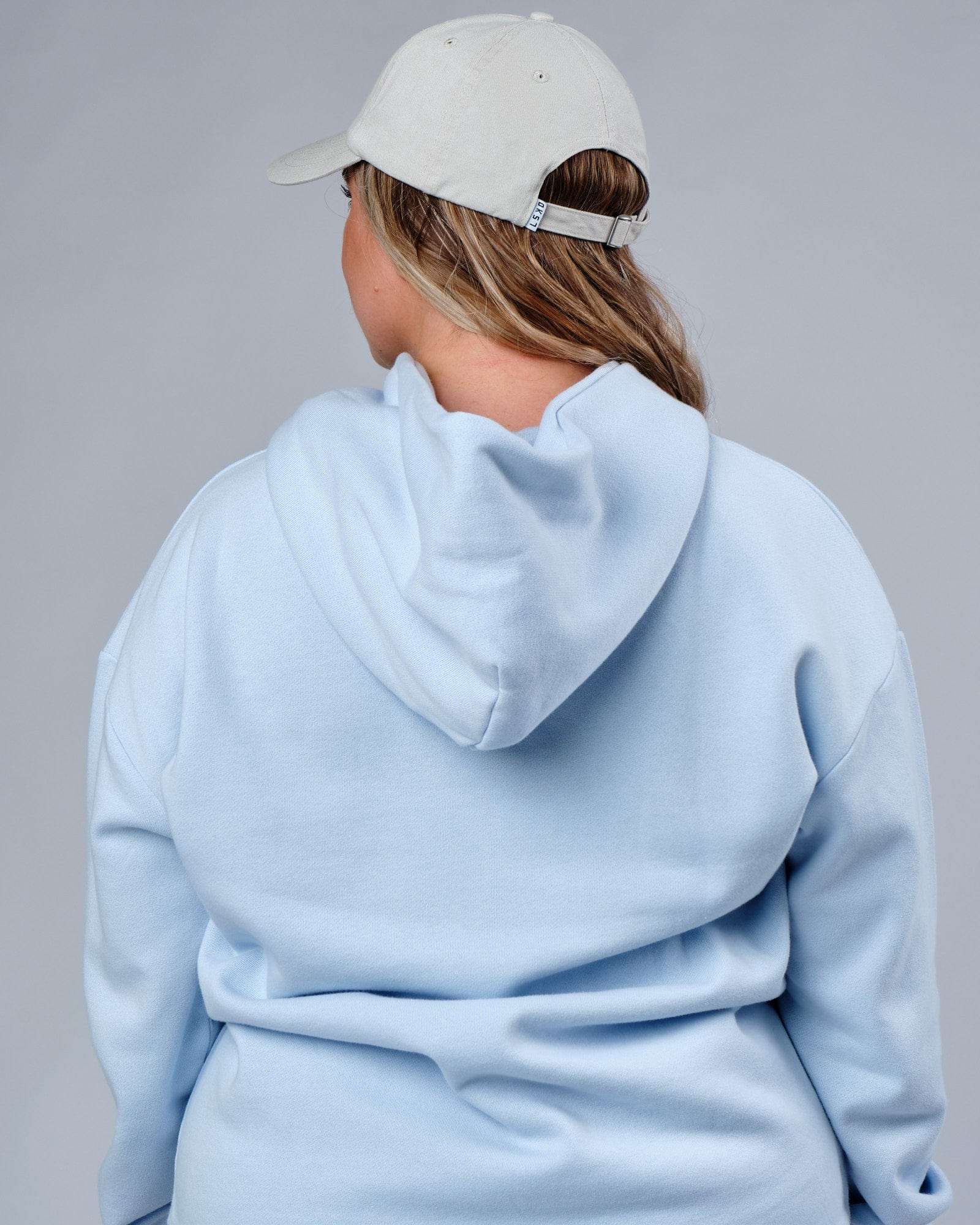 Model wearing Compact Cap - Bone