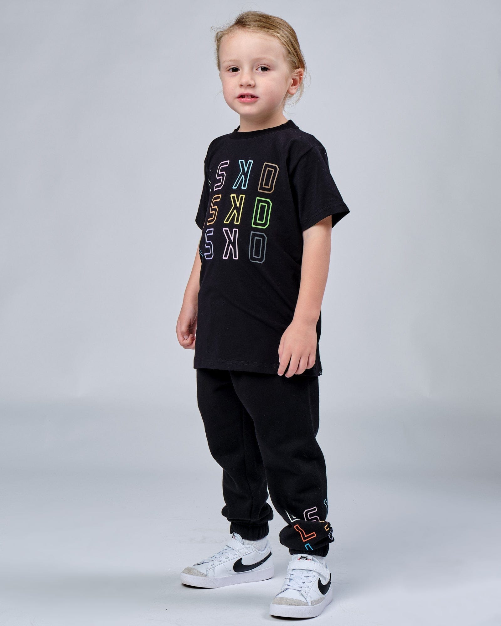 Model wearing Progress Track Pant (00-8) - Black