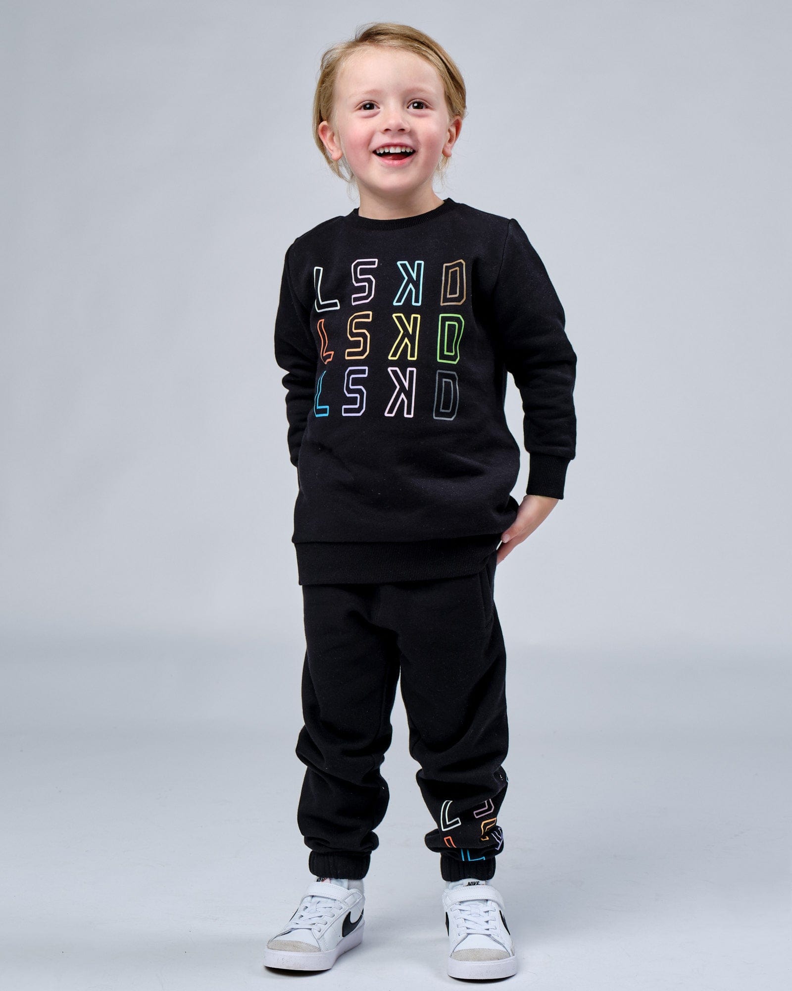 Model wearing Progress Track Pant (00-8) - Black