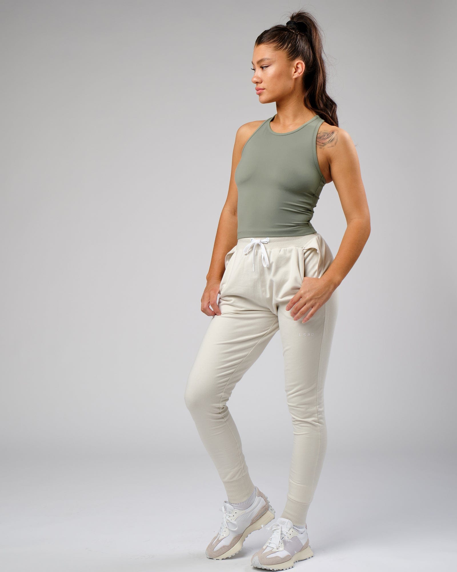 Model wearing Flow Performance Tank - Dusty Olive