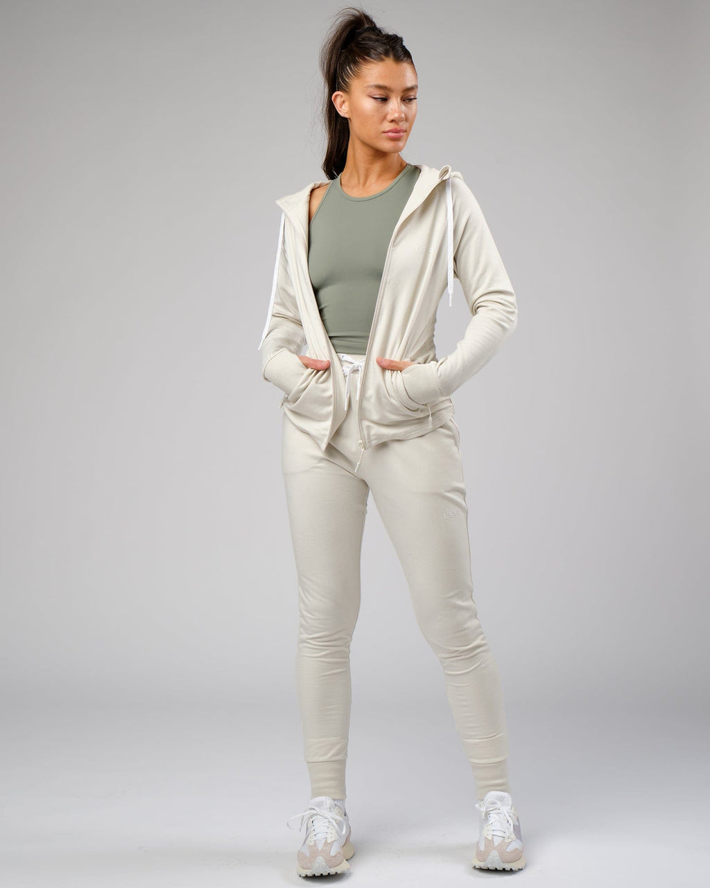 Model wearing Flow Performance Tank - Dusty Olive