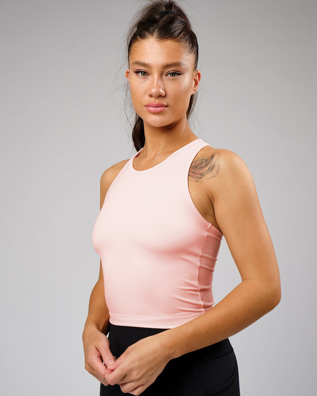 Model wearing Flow Performance Tank - Pink
