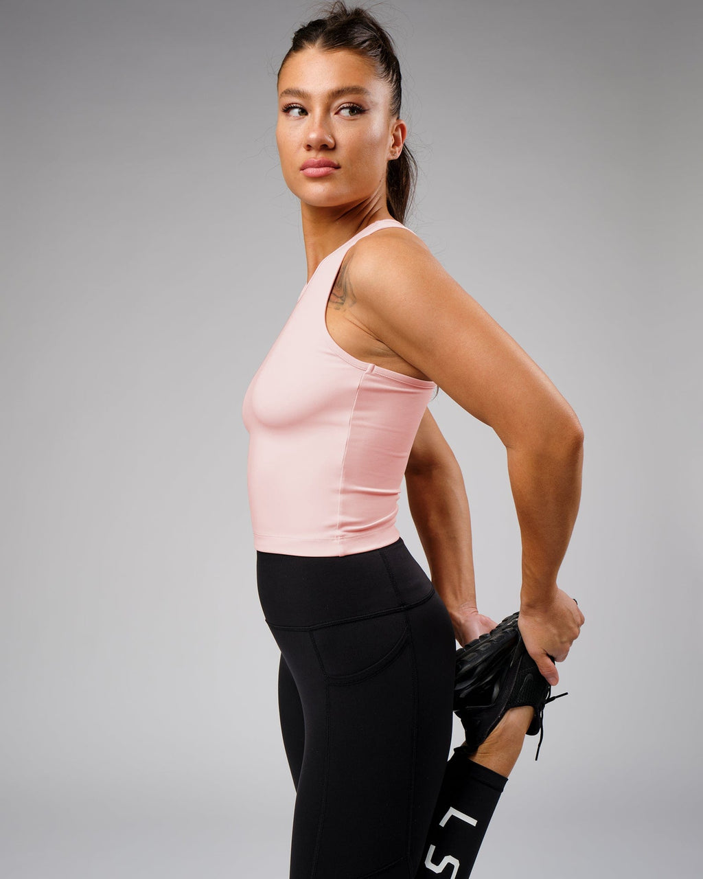 Model wearing Flow Performance Tank - Pink