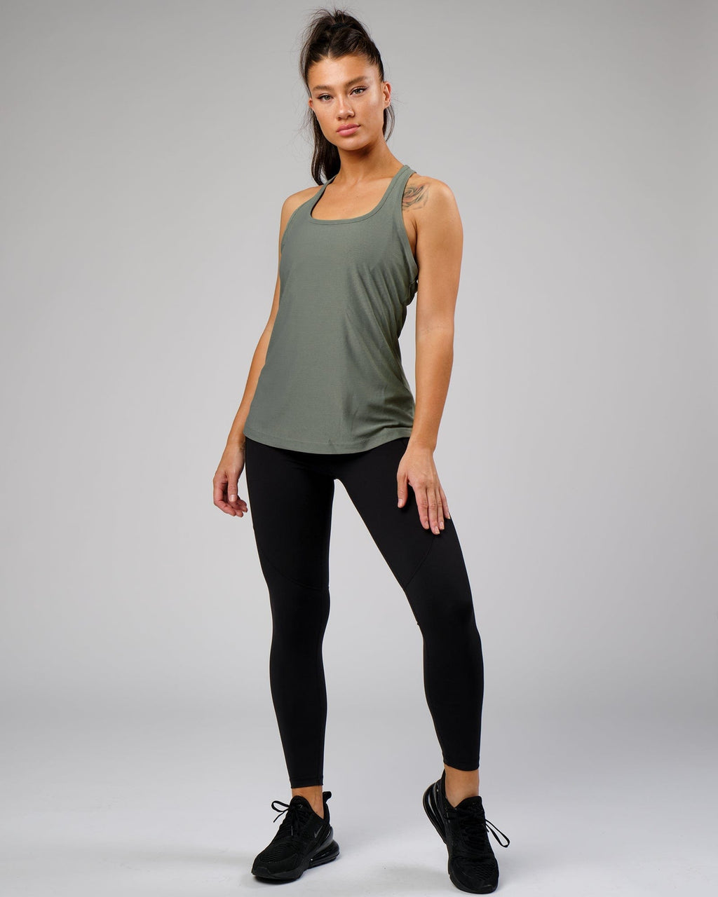 Model wearing Freedom Performance Tank - Dusty Olive
