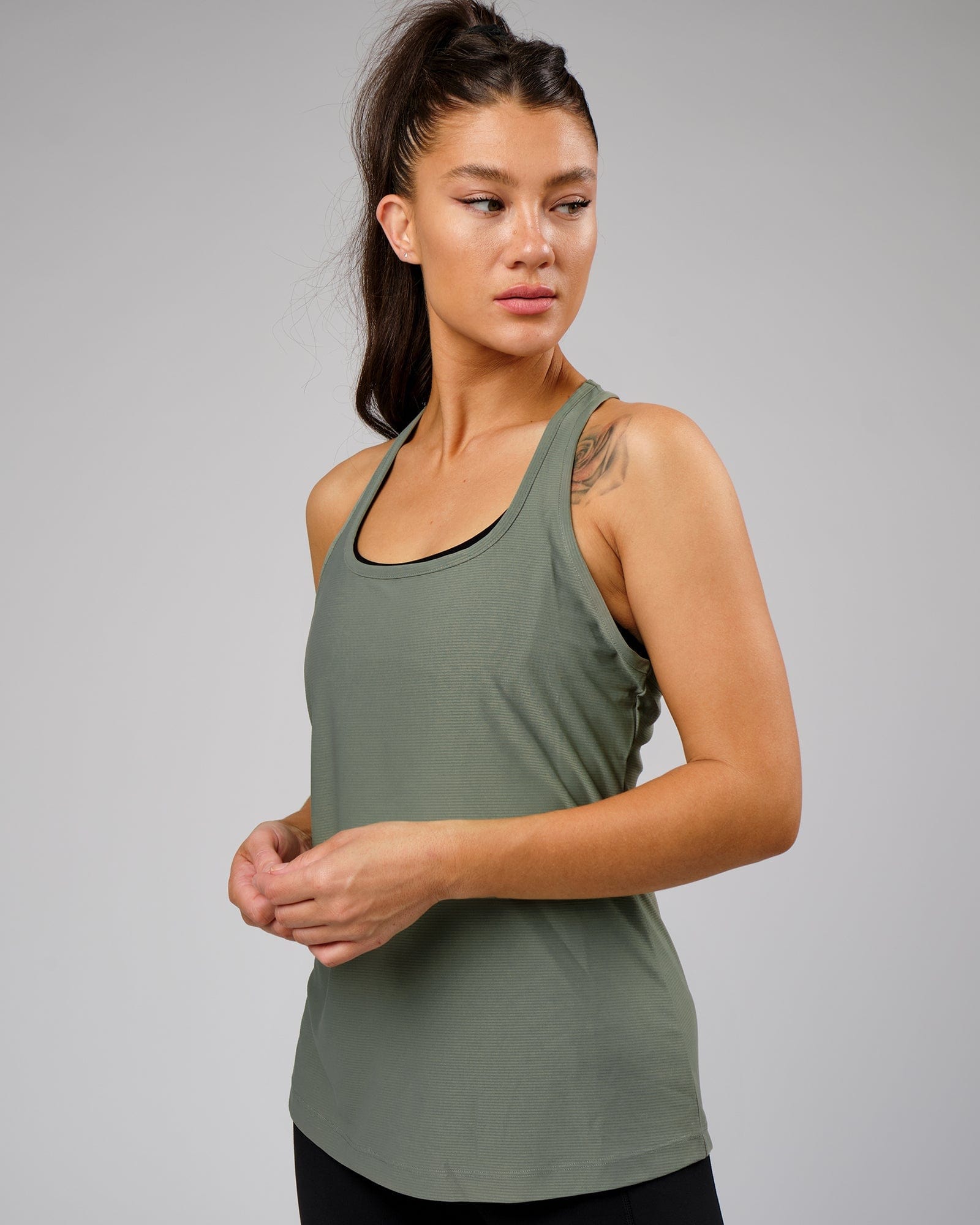 Model wearing Freedom Performance Tank - Dusty Olive