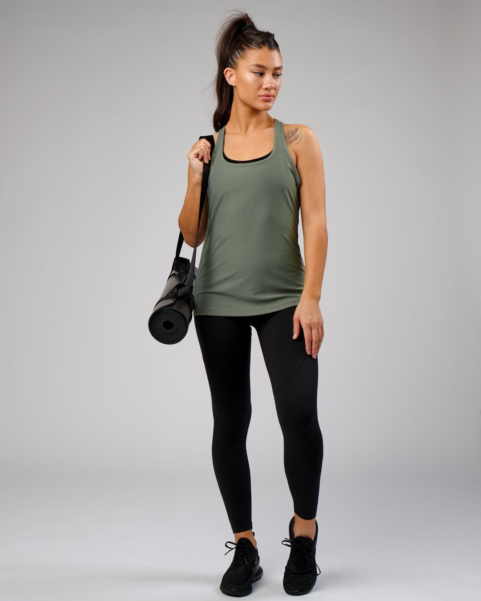 Model wearing Freedom Performance Tank - Dusty Olive