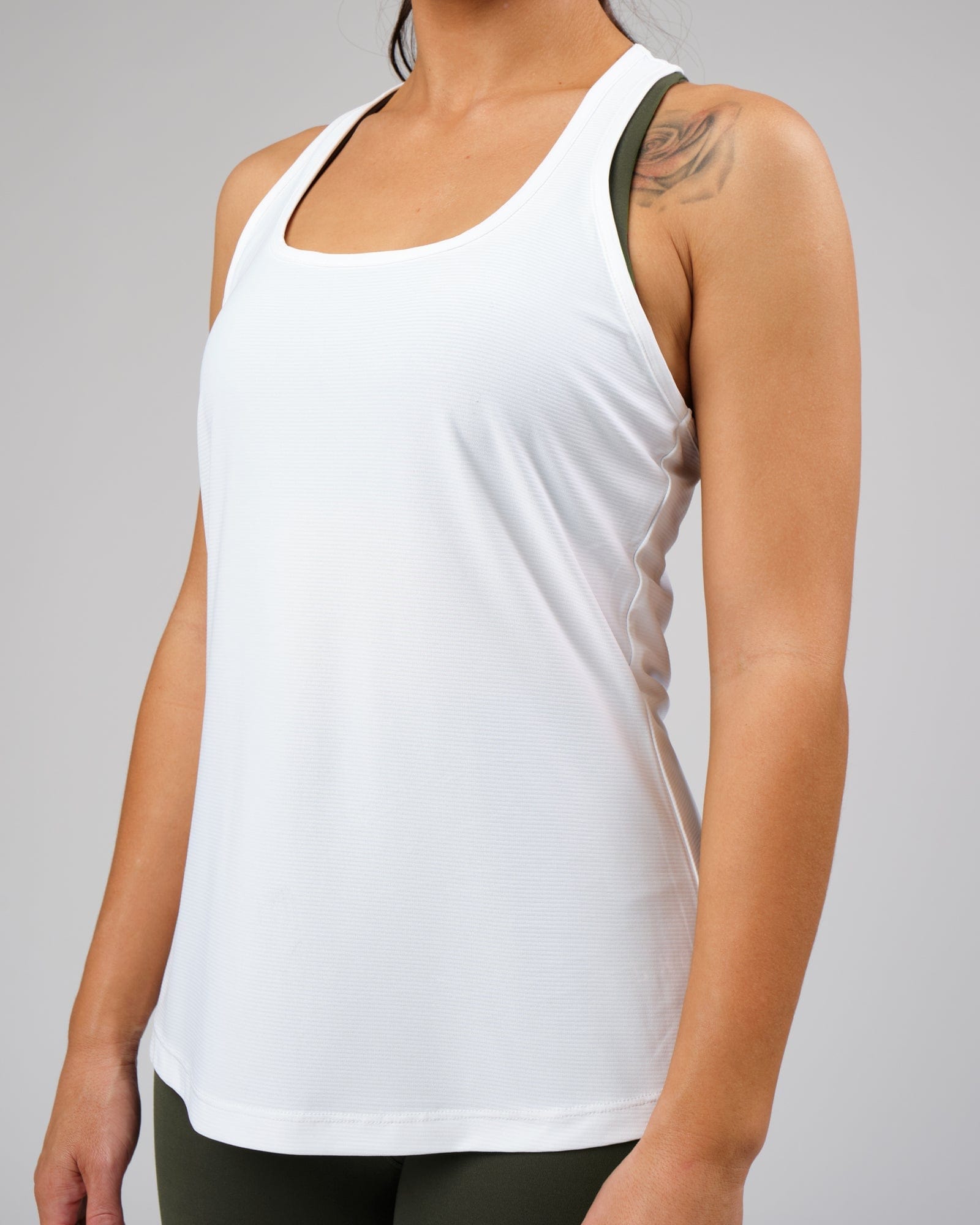 Model wearing Freedom Performance Tank - White