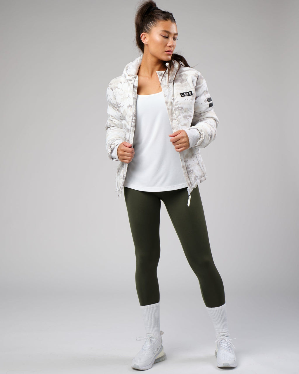 Model wearing Freedom Performance Tank - White