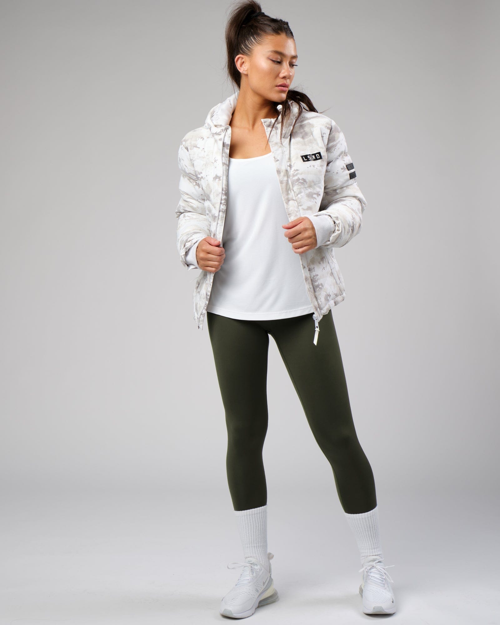 Model wearing Freedom Performance Tank - White