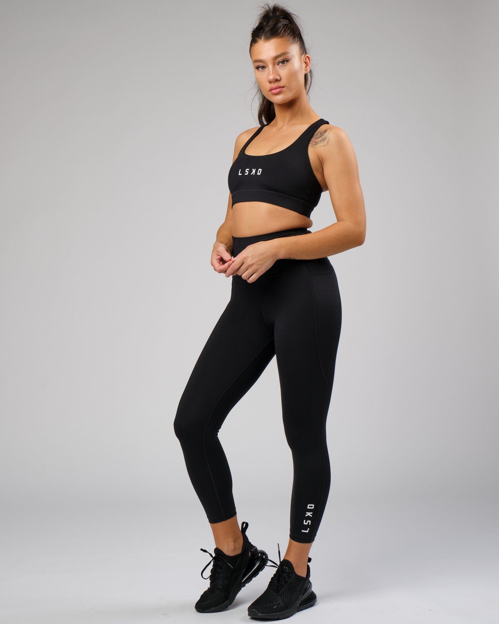 Model wearing Flux 7/8 Length Tight - Black