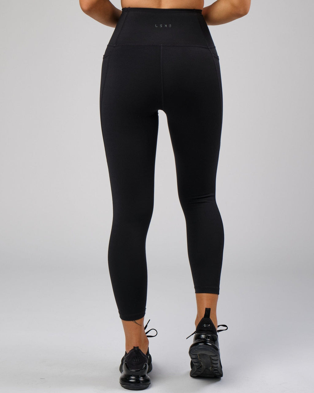 Model wearing Flux 7/8 Length Tight - Black