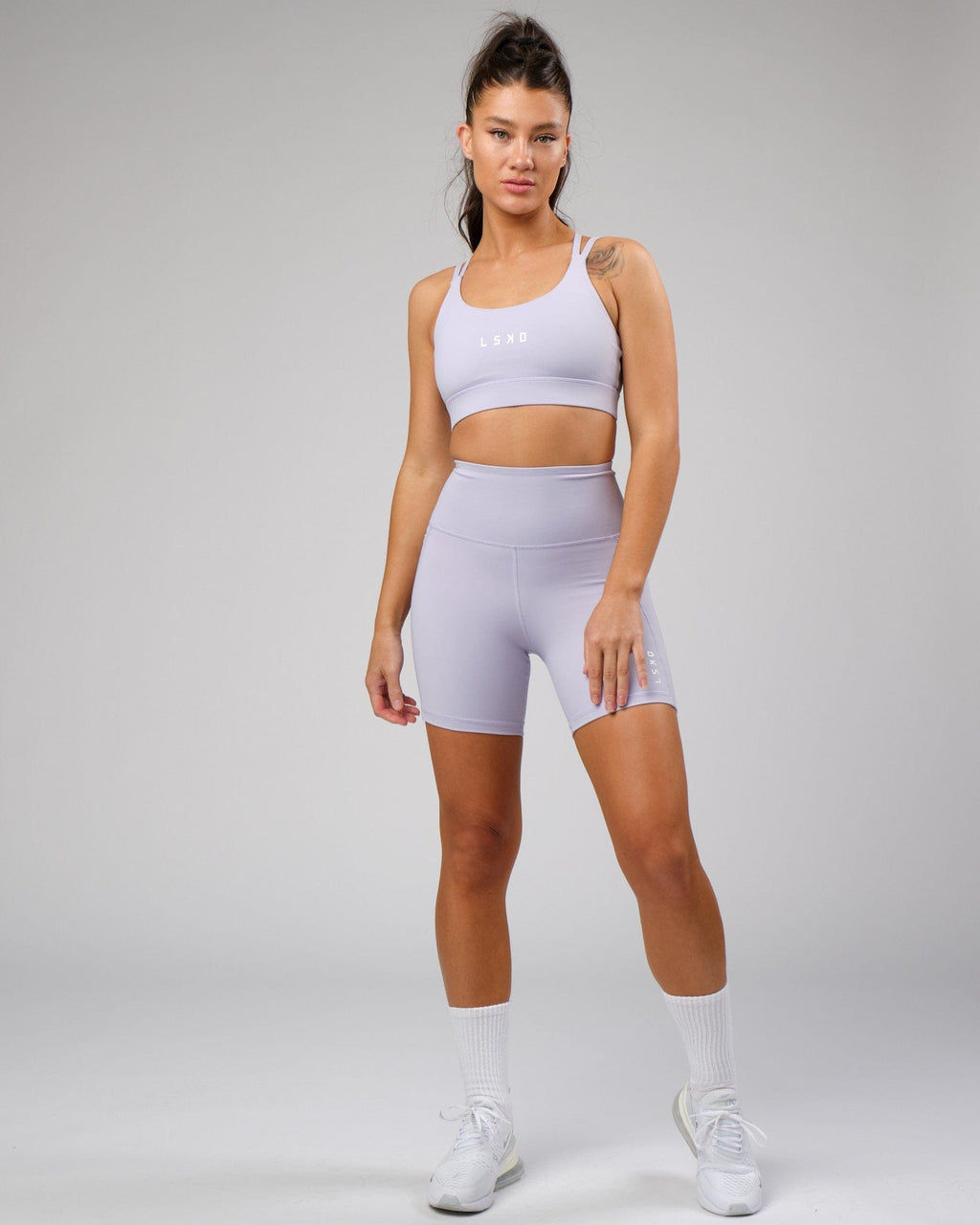 Model wearing Bridge Recycled Sports Bra - Cosmic Sky