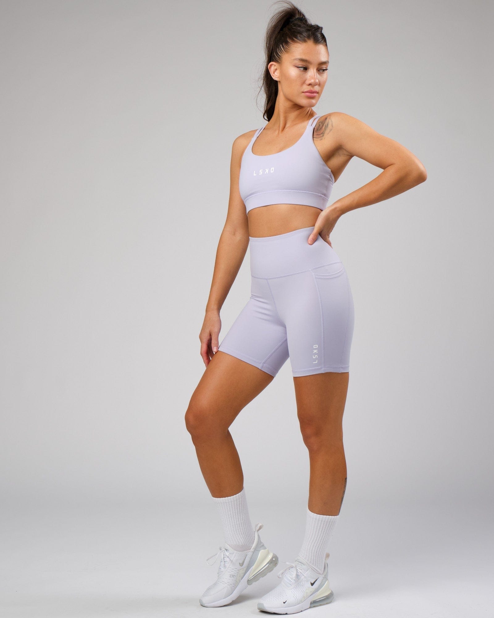 Model wearing Bridge Recycled Sports Bra - Cosmic Sky