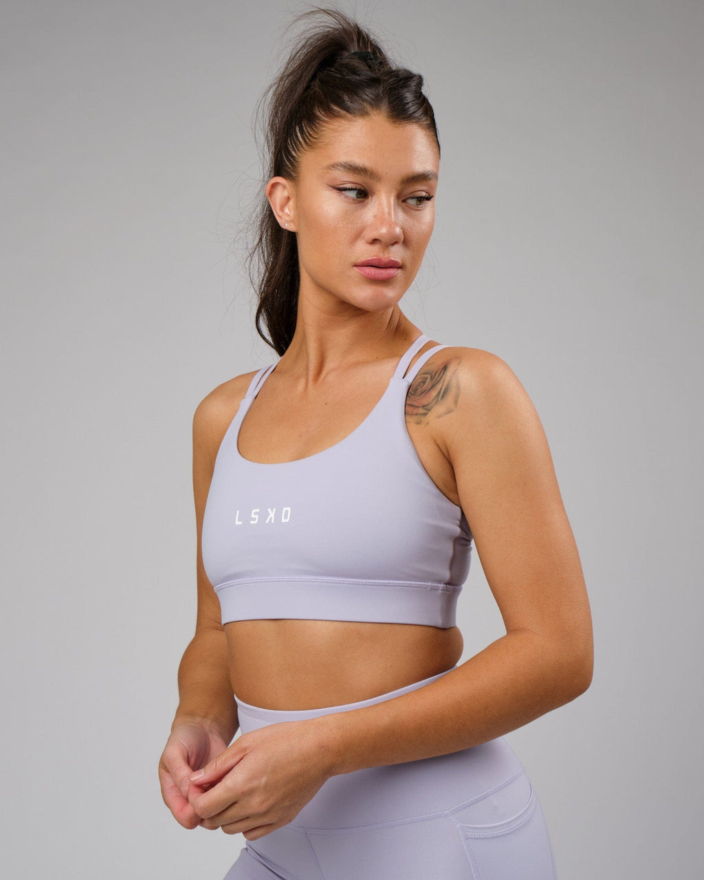 Model wearing Bridge Recycled Sports Bra - Cosmic Sky