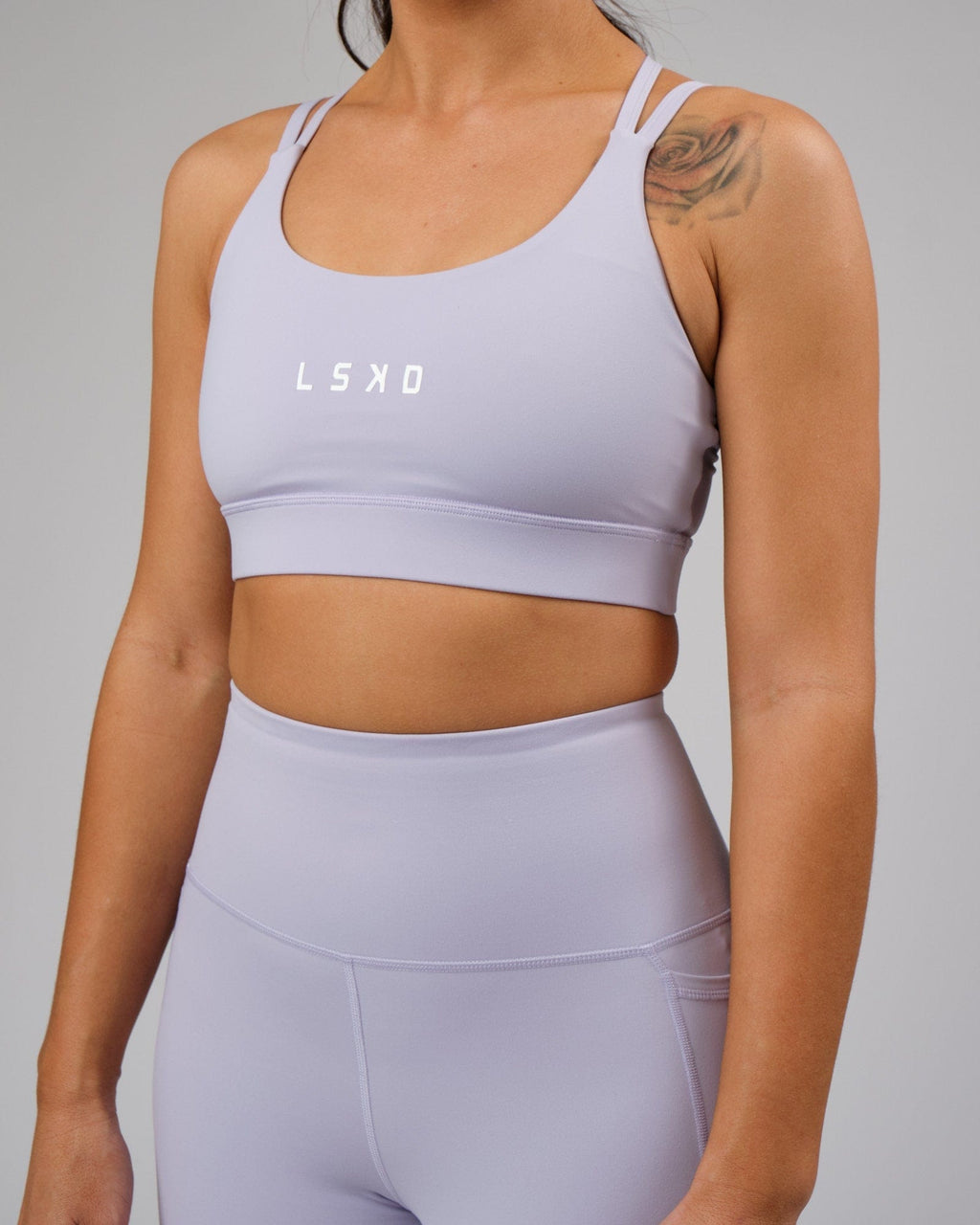 Model wearing Bridge Recycled Sports Bra - Cosmic Sky