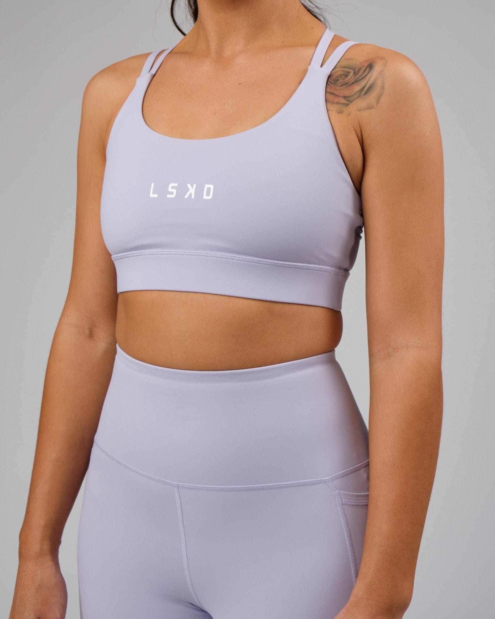 Model wearing Bridge Recycled Sports Bra - Cosmic Sky