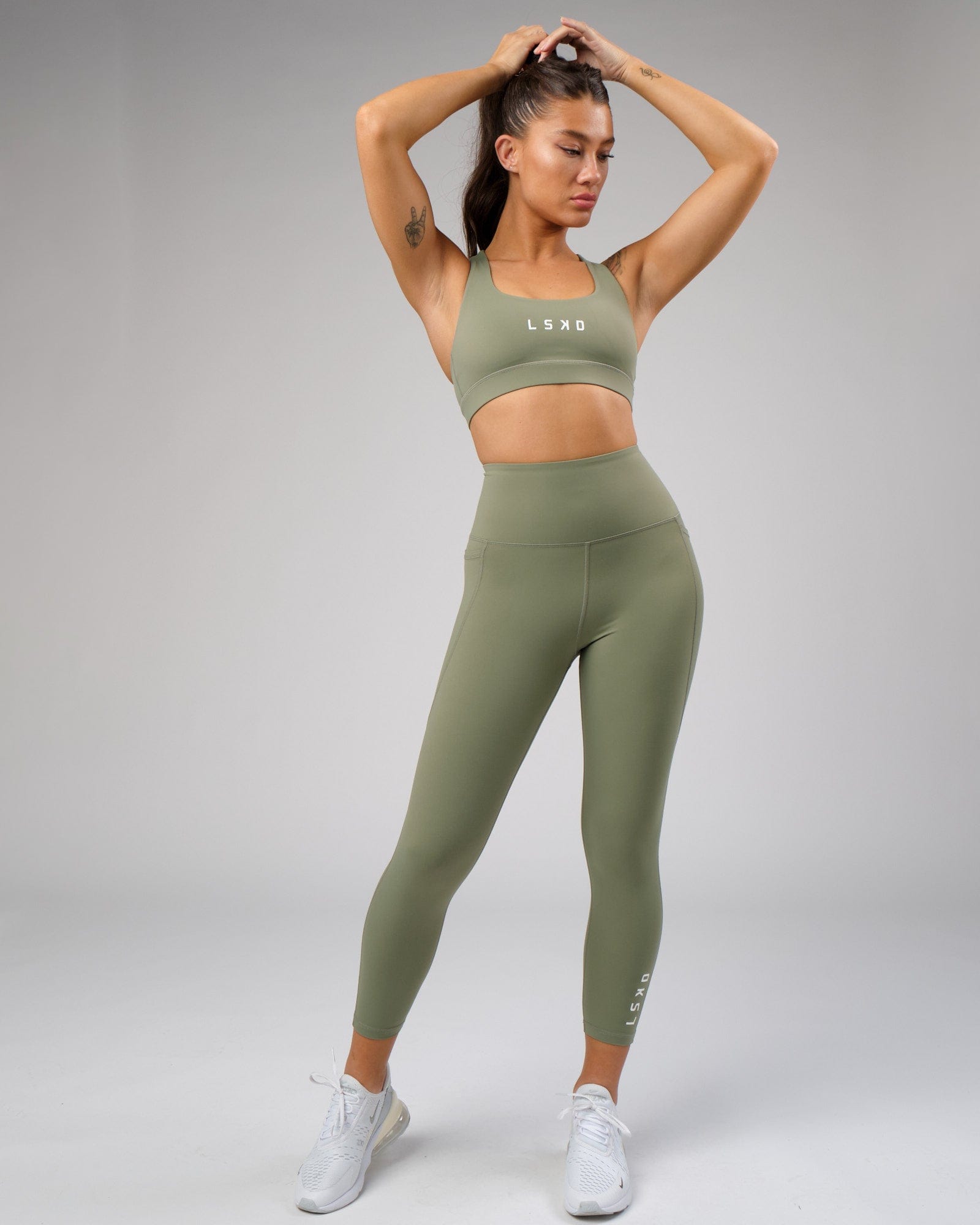 Model wearing Flux Recycled 7/8 Length Tight - Sea Spray