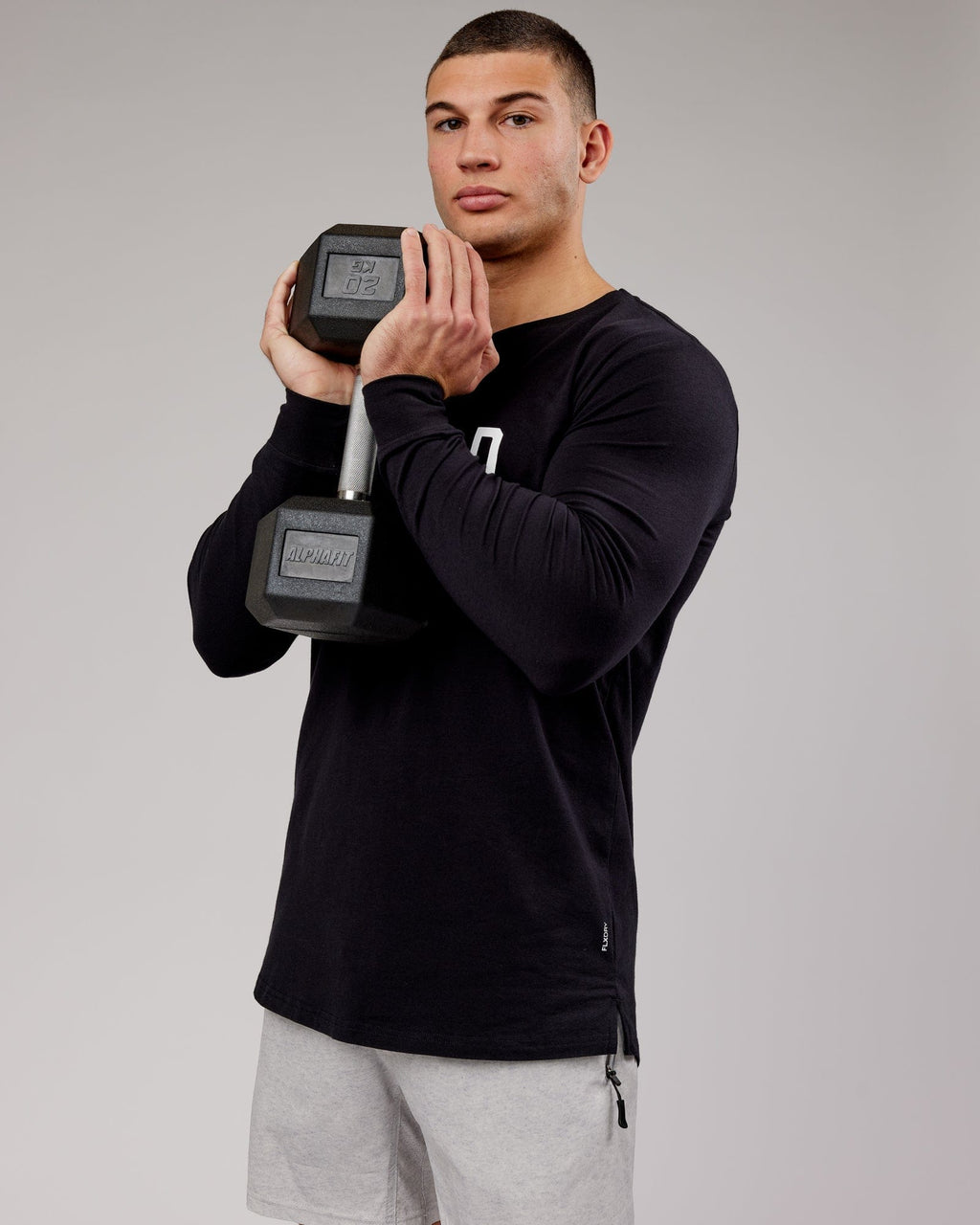 Model wearing Power FLXDRY Performance LS Tee - Black