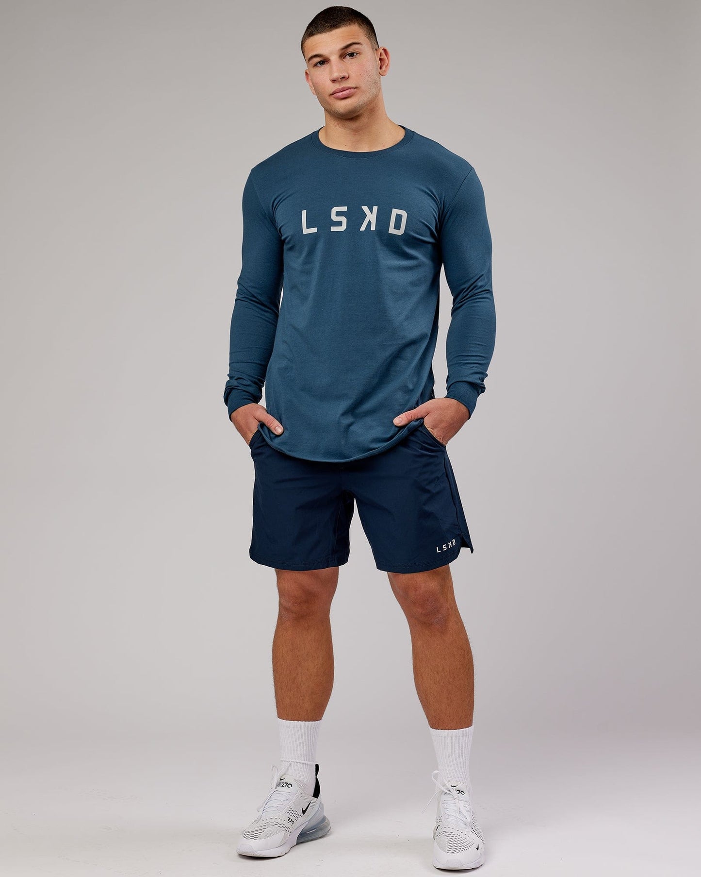 Model wearing Power FLXDRY Performance LS Tee - Light Navy