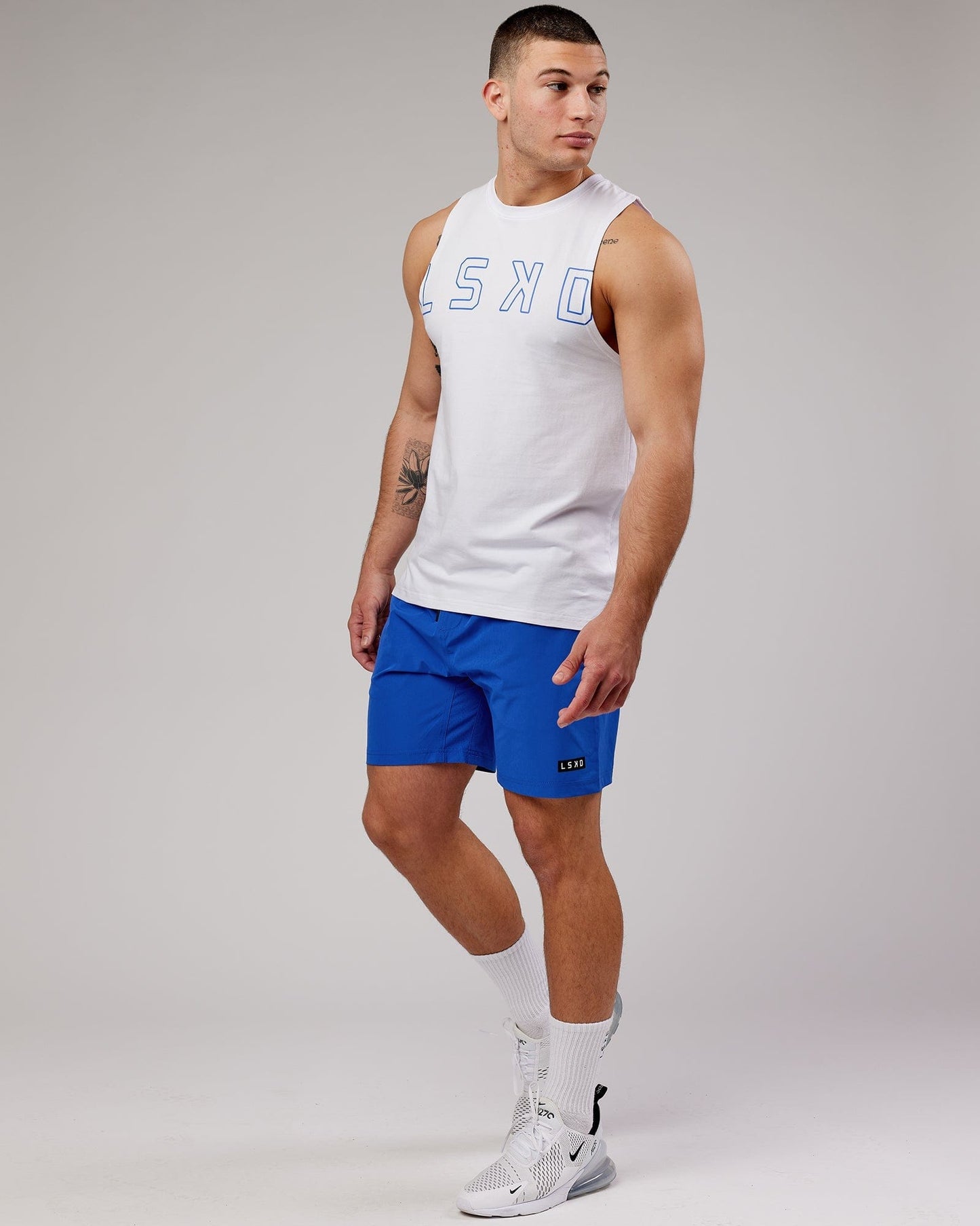 Model wearing Expand FLXCotton Training Fit Tank - White-Cobalt