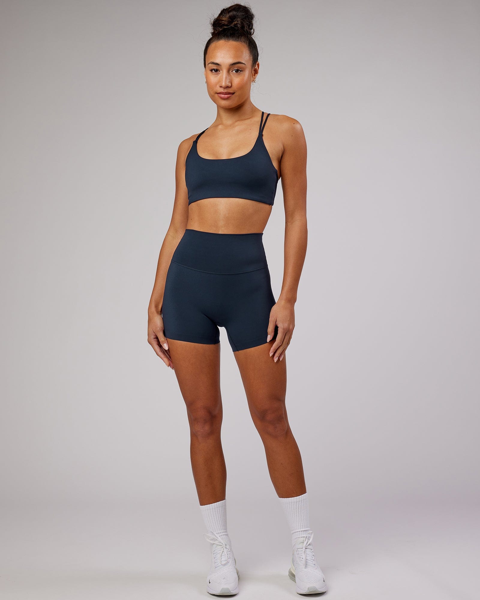 Model wearing Elixir X-Short Tight - Navy No Logo