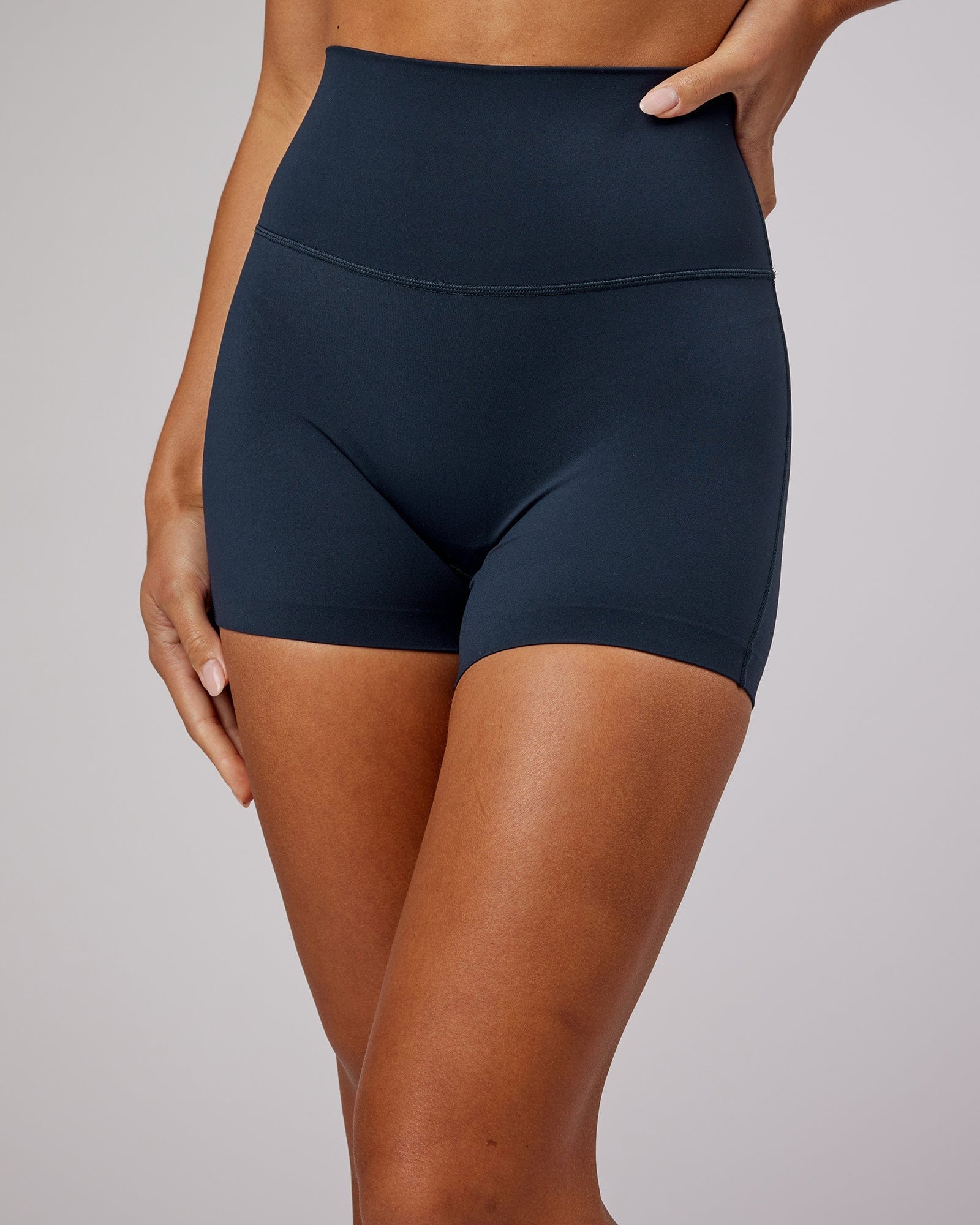 Model wearing Elixir X-Short Tight - Navy No Logo