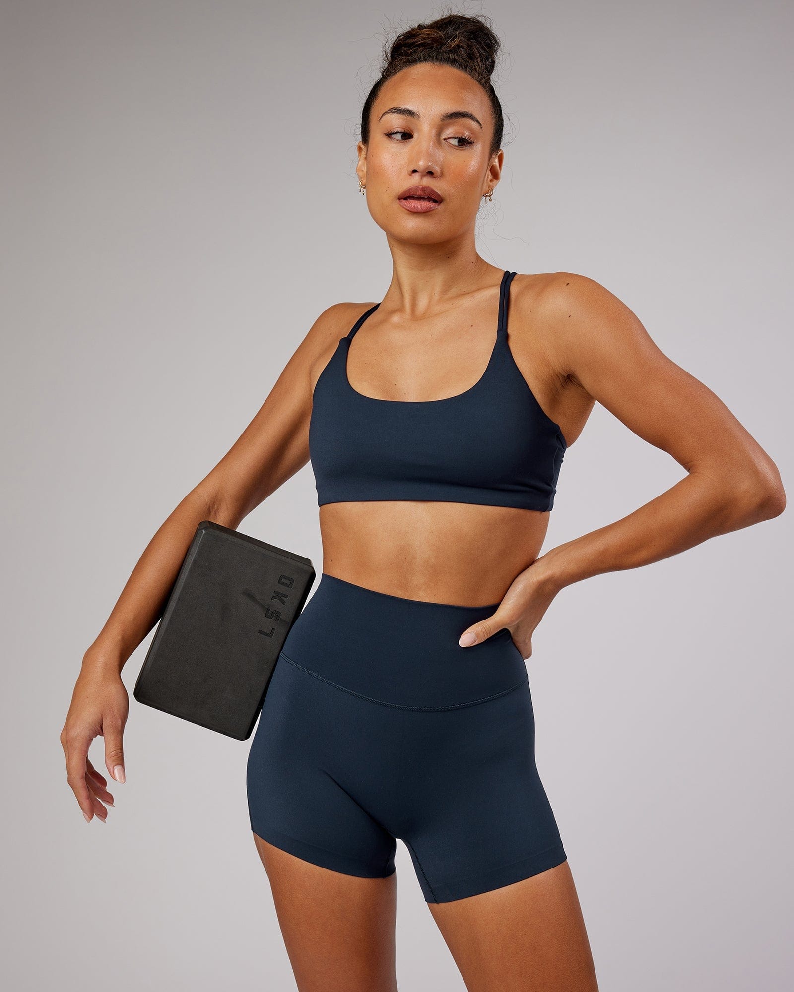 Model wearing Elixir X-Short Tight - Navy No Logo