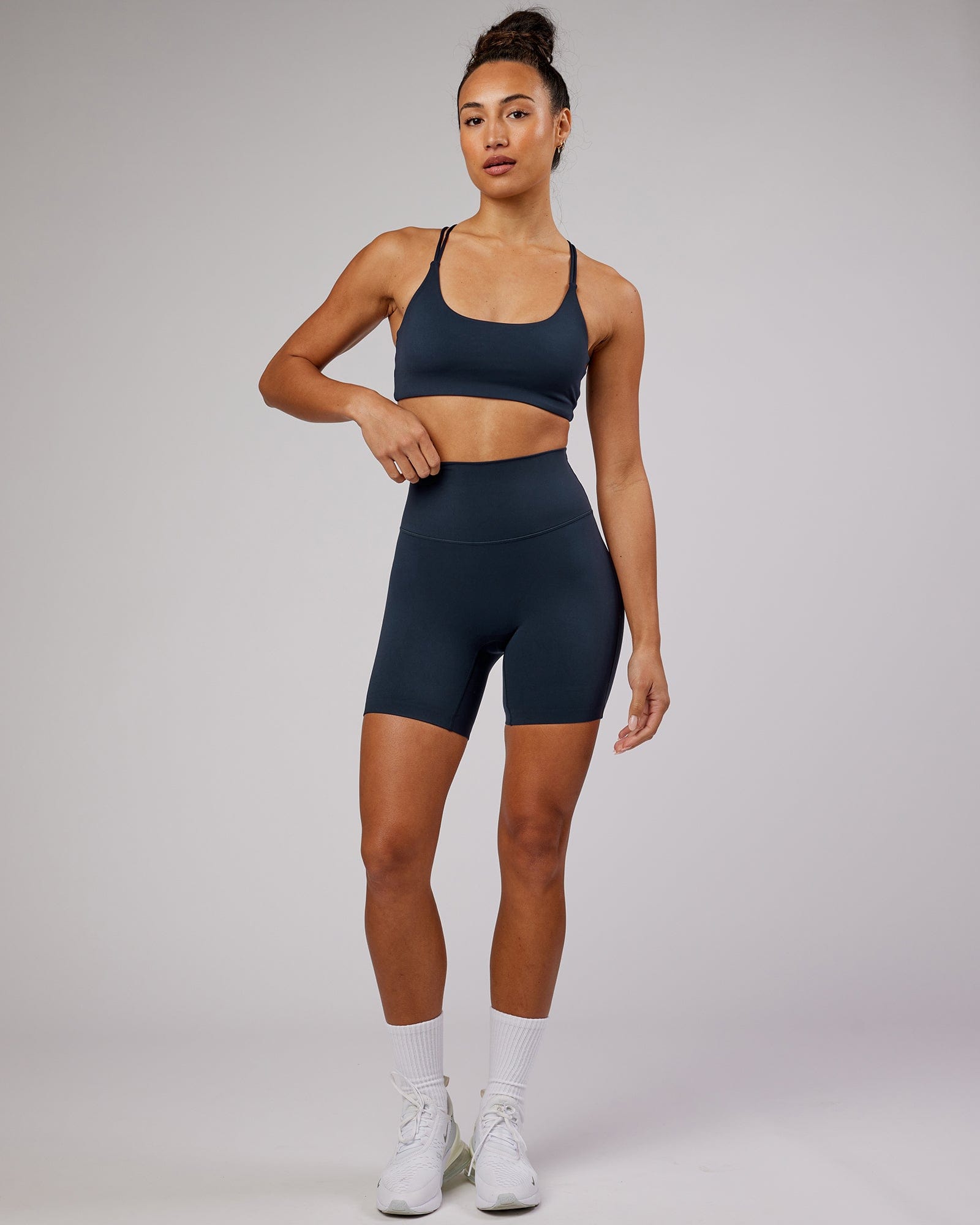 Model wearing Elixir Mid Short Tight - Navy No Logo