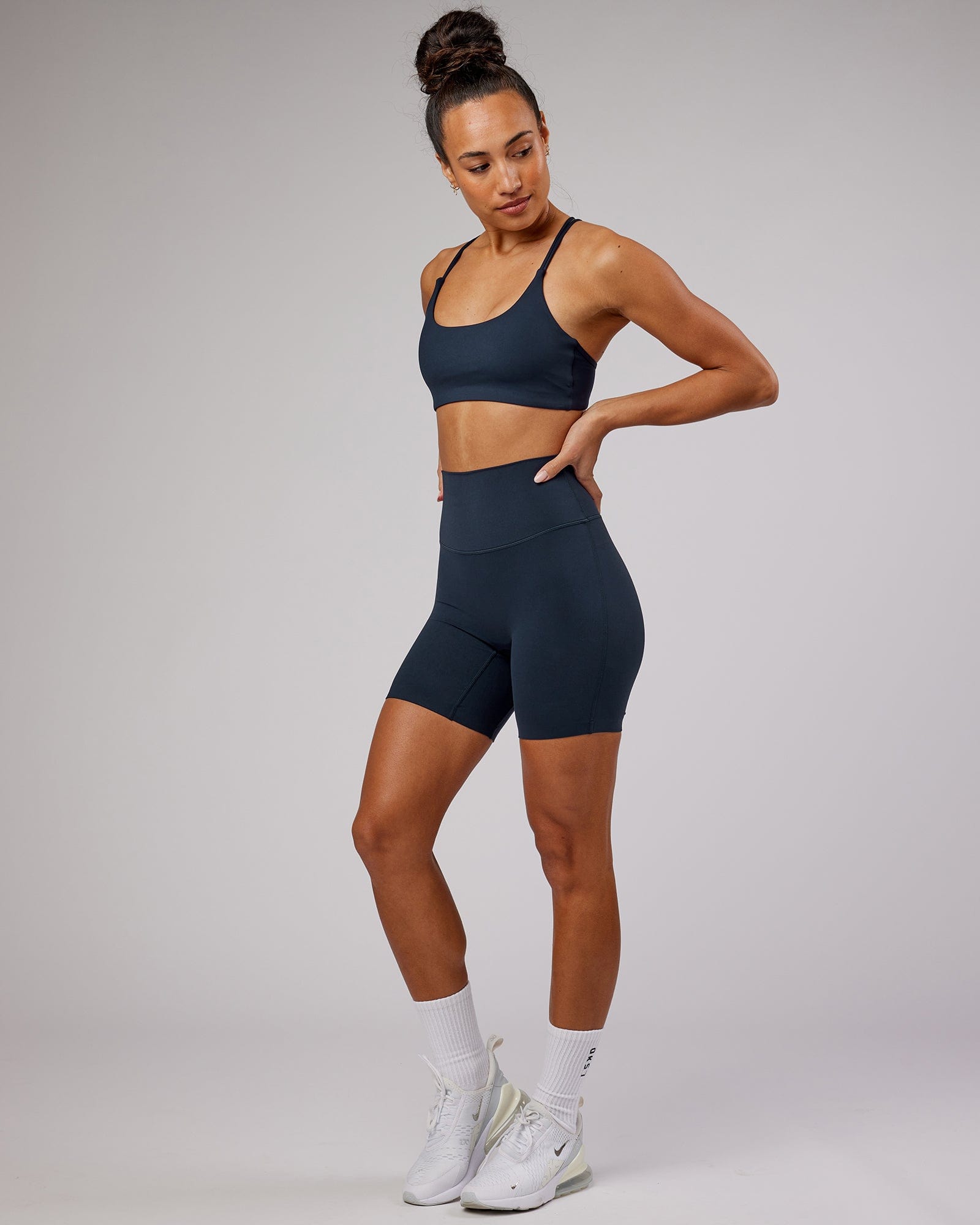 Model wearing Elixir Mid Short Tight - Navy No Logo