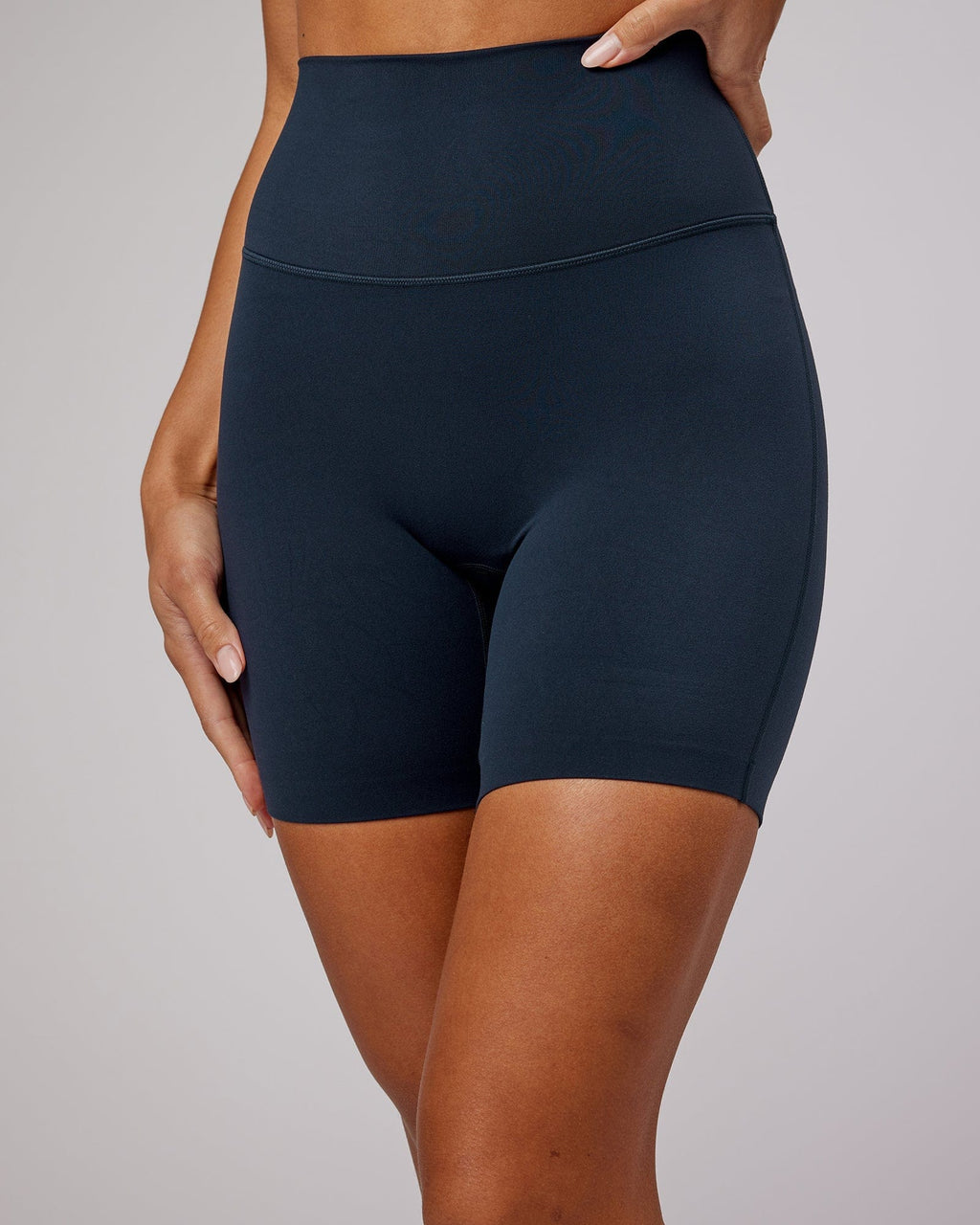 Model wearing Elixir Mid Short Tight - Navy No Logo