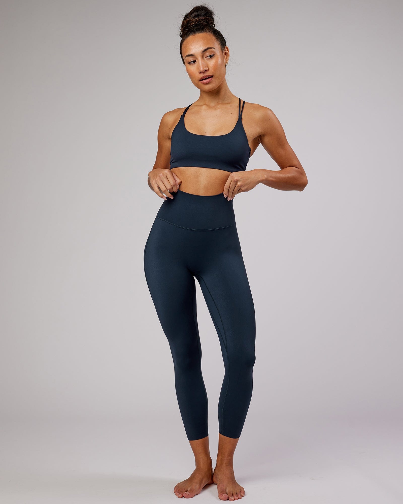 Model wearing Elixir 7/8 Length Tight - Navy No Logo