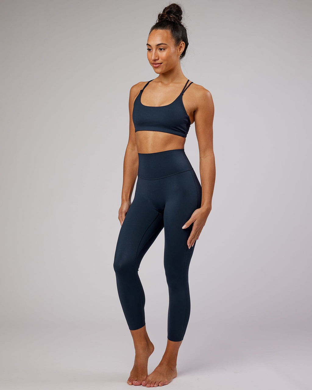 Model wearing Elixir 7/8 Length Tight - Navy No Logo