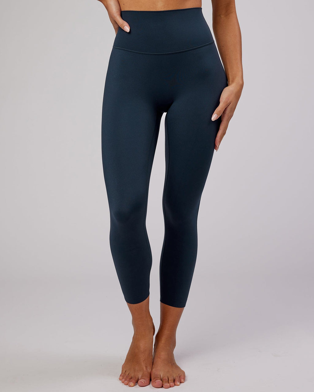Model wearing Elixir 7/8 Length Tight - Navy No Logo