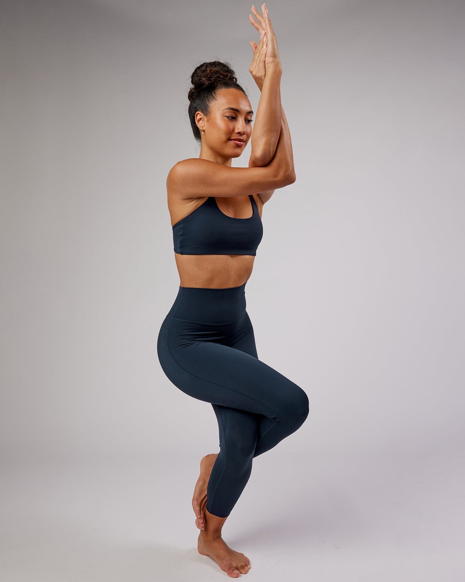 Model wearing Elixir 7/8 Length Tight - Navy No Logo