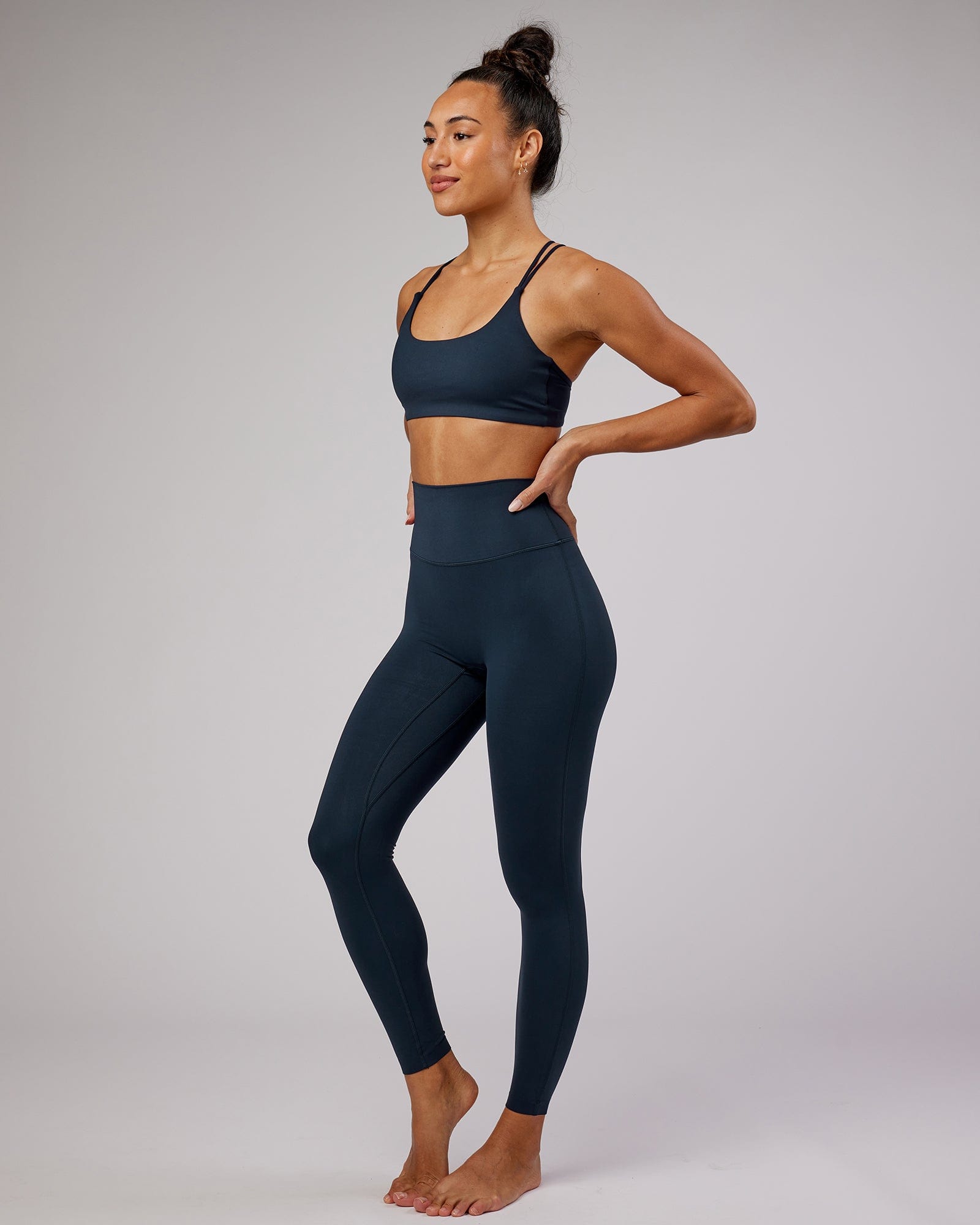 Model wearing Elixir Full Length Tight - Navy No Logo